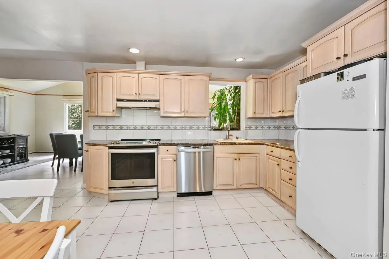 View of Family room in the back, currently used as dining room. View of Family room in the back, currently used as dining room.