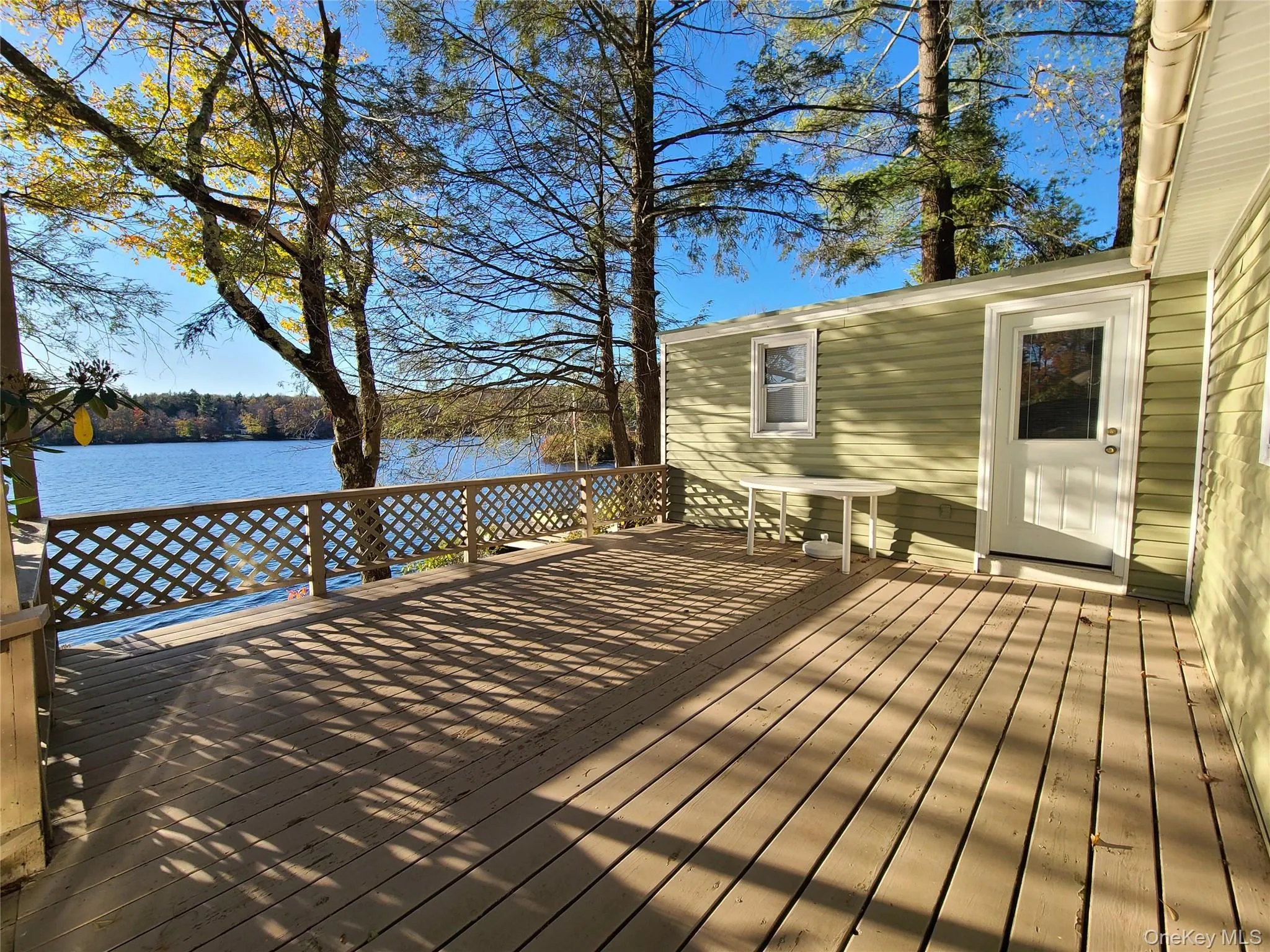 Wooden deck with a water view Wooden deck with a water view