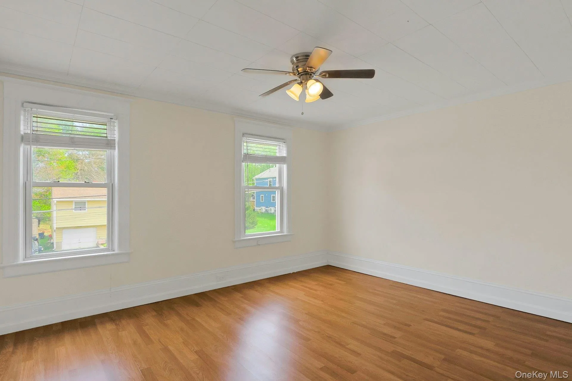 Bedroom at front of the house with hardwood floors Bedroom at front of the house with hardwood floors
