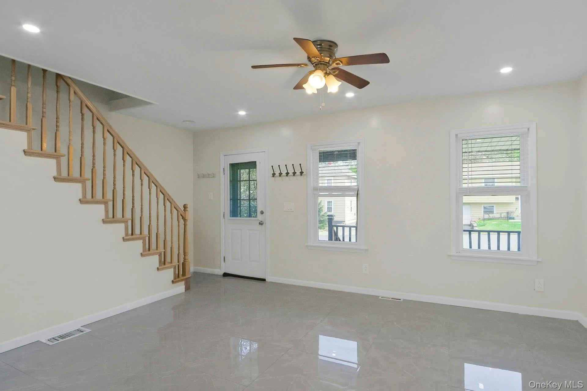 Living room. Light, bright with marble-styled tile foor Living room. Light, bright with marble-styled tile foor