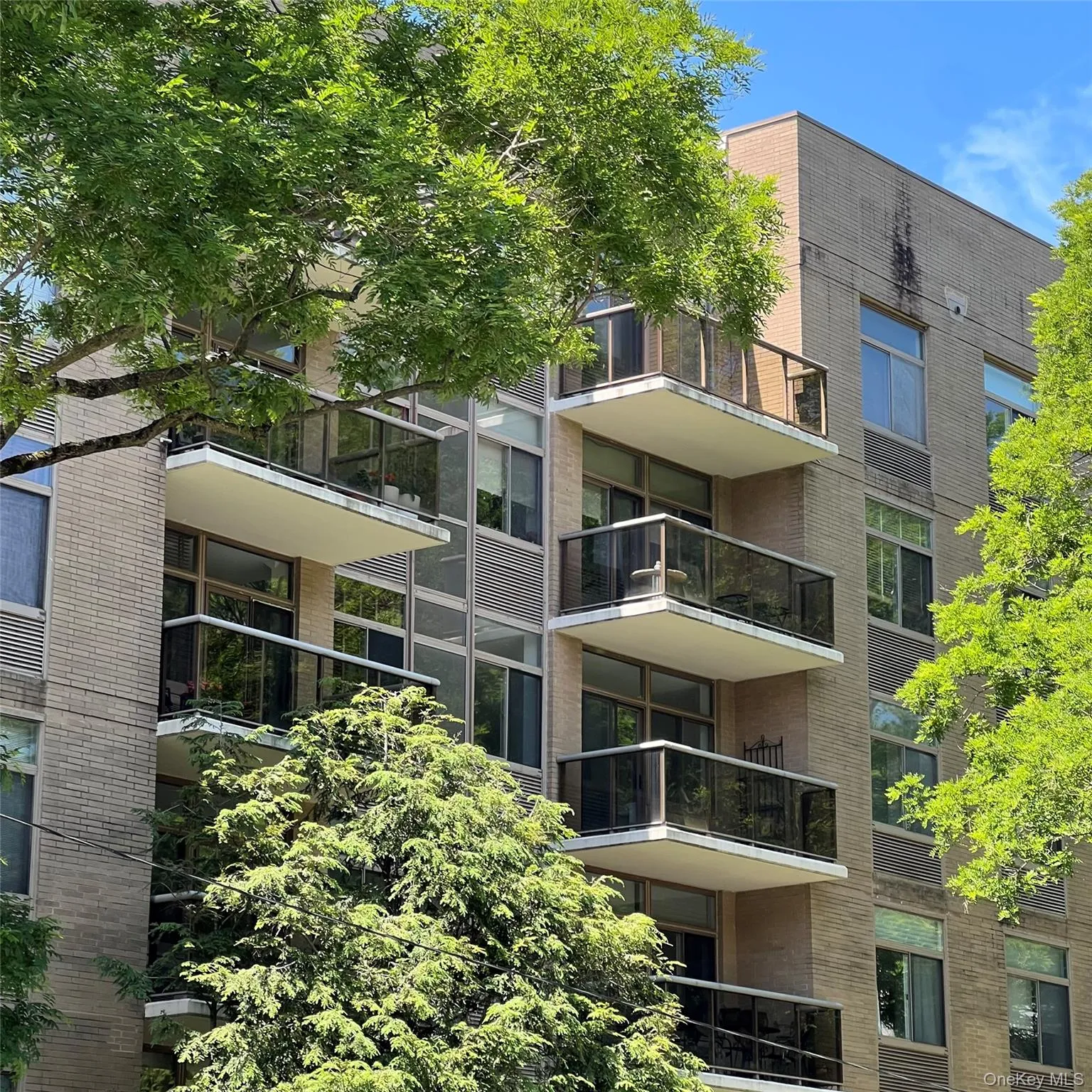 Building facade featuring multiple private balconies Building facade featuring multiple private balconies