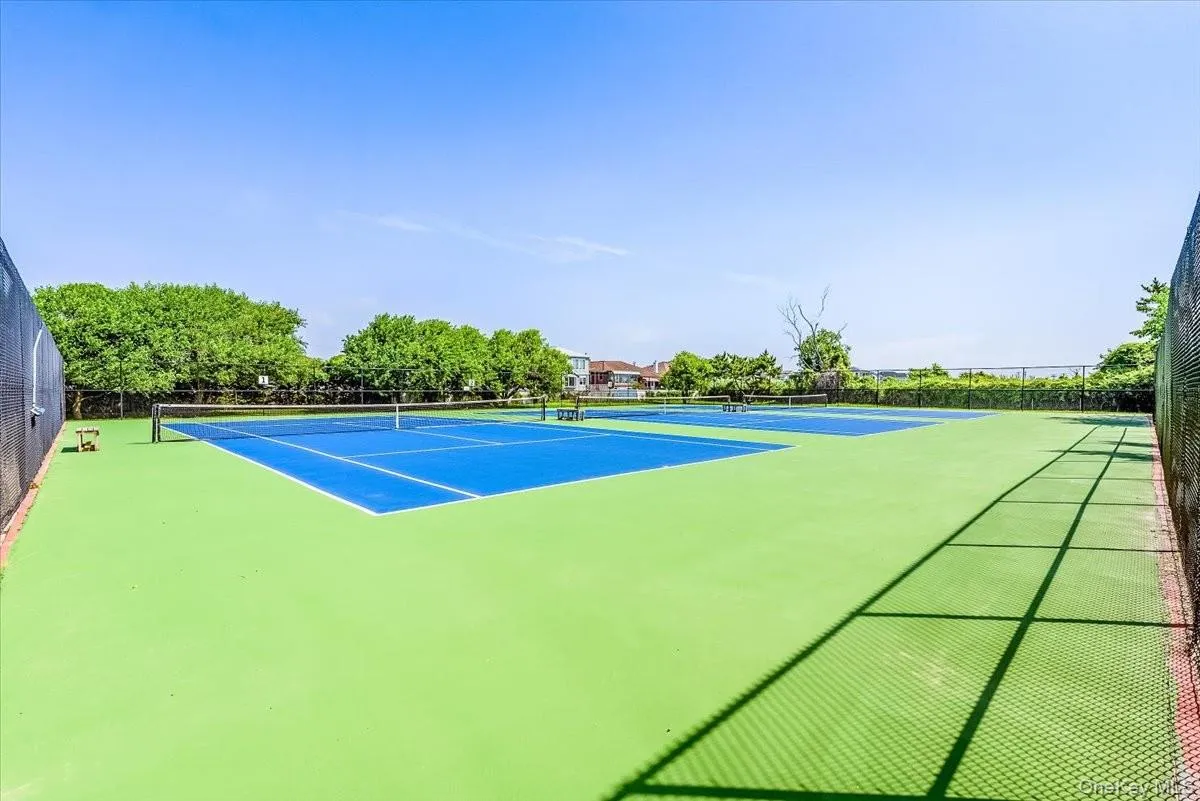 View of tennis court with community basketball court plus 2 pickle ball courts View of tennis court with community basketball court plus 2 pickle ball courts
