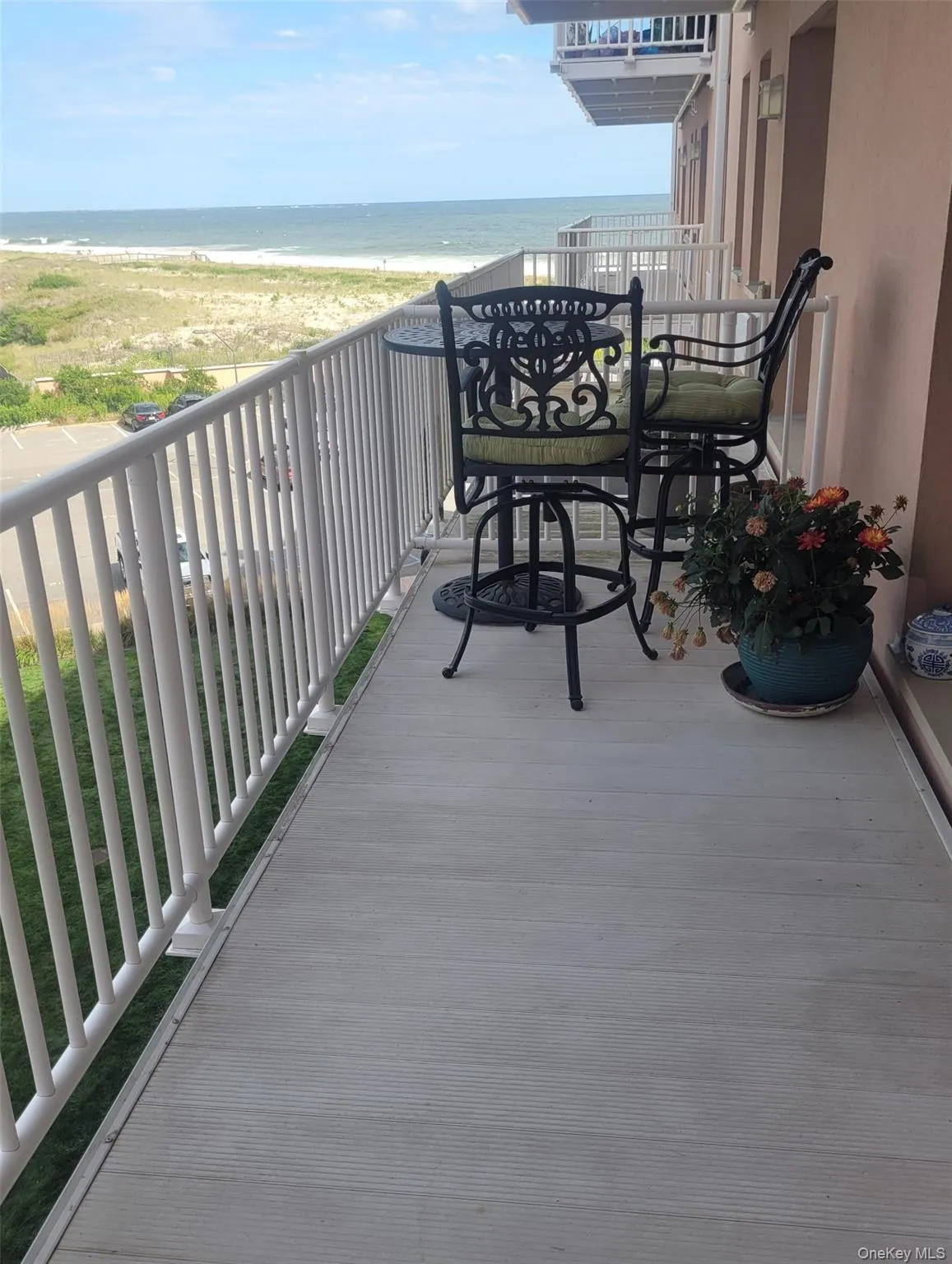 Balcony featuring view of water and beach Balcony featuring view of water and beach