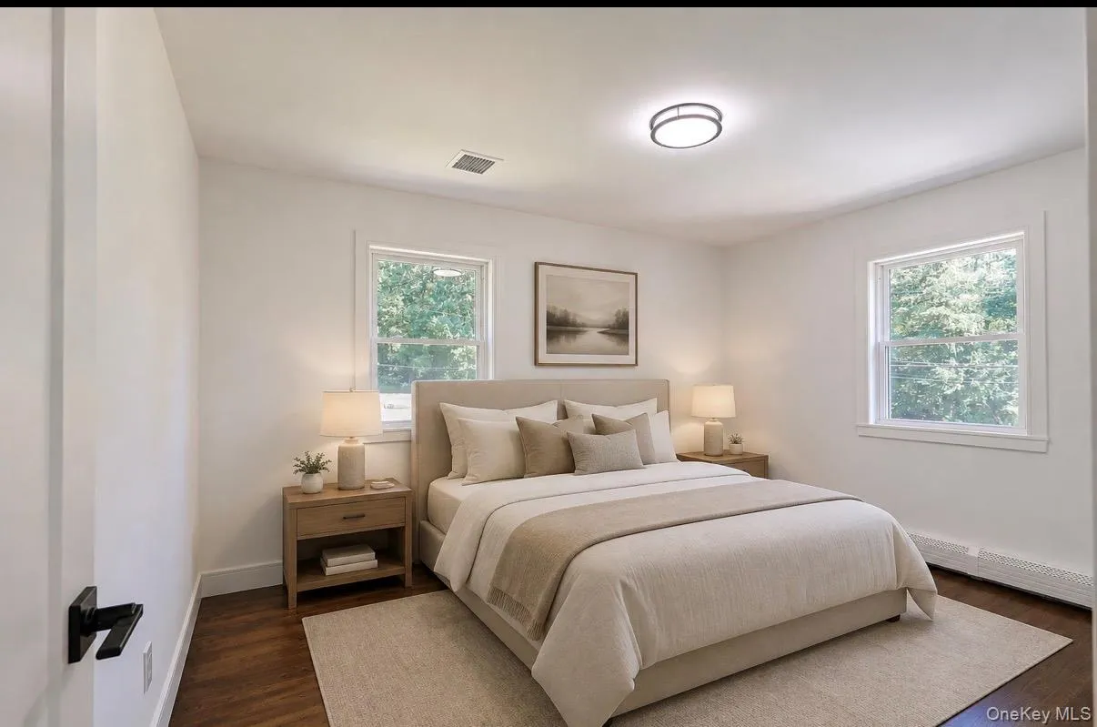 Dark wood-finish flooring with white walls Dark wood-finish flooring with white walls