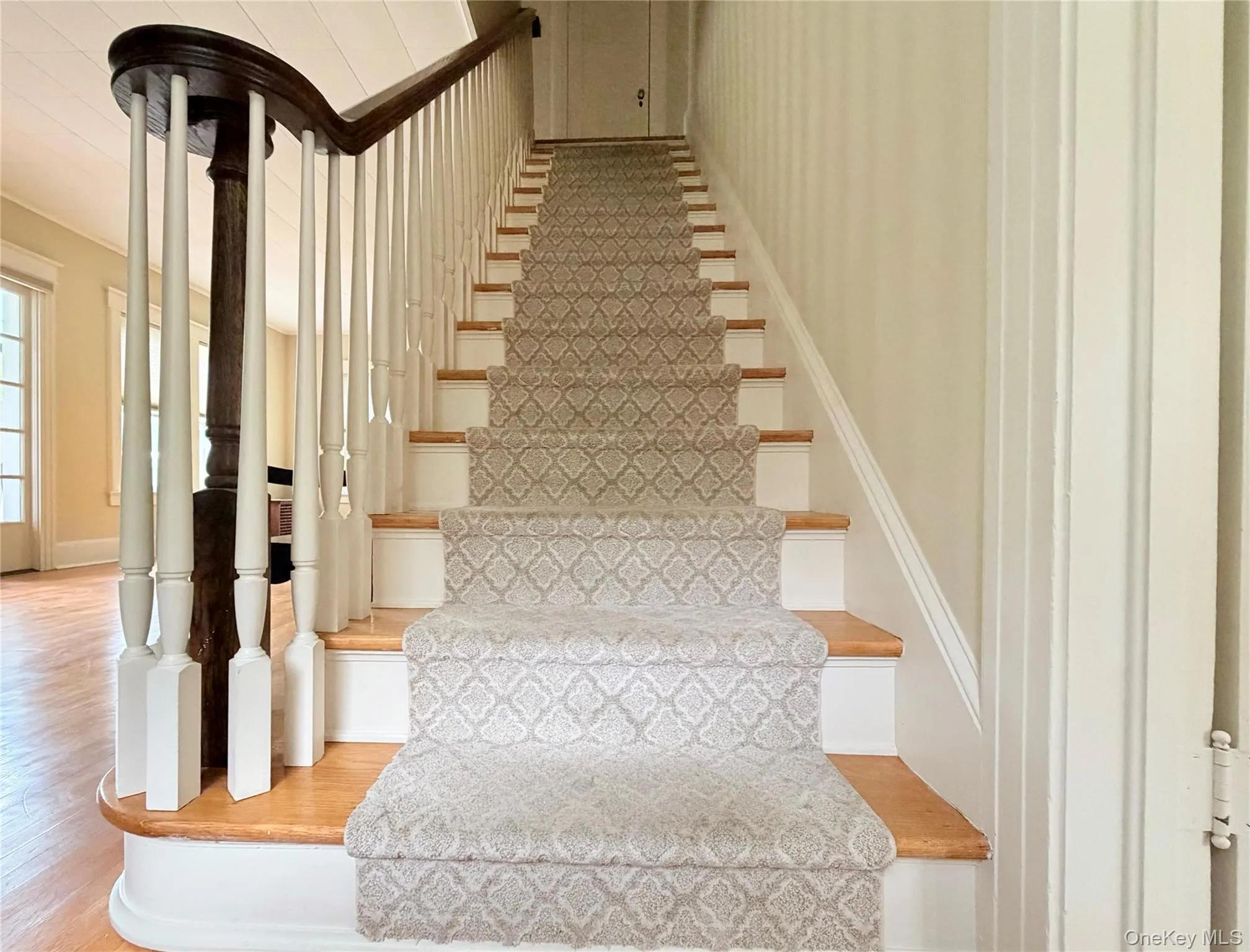 Stairwell to second floor with intricate banister details. Stairwell to second floor with intricate banister details.