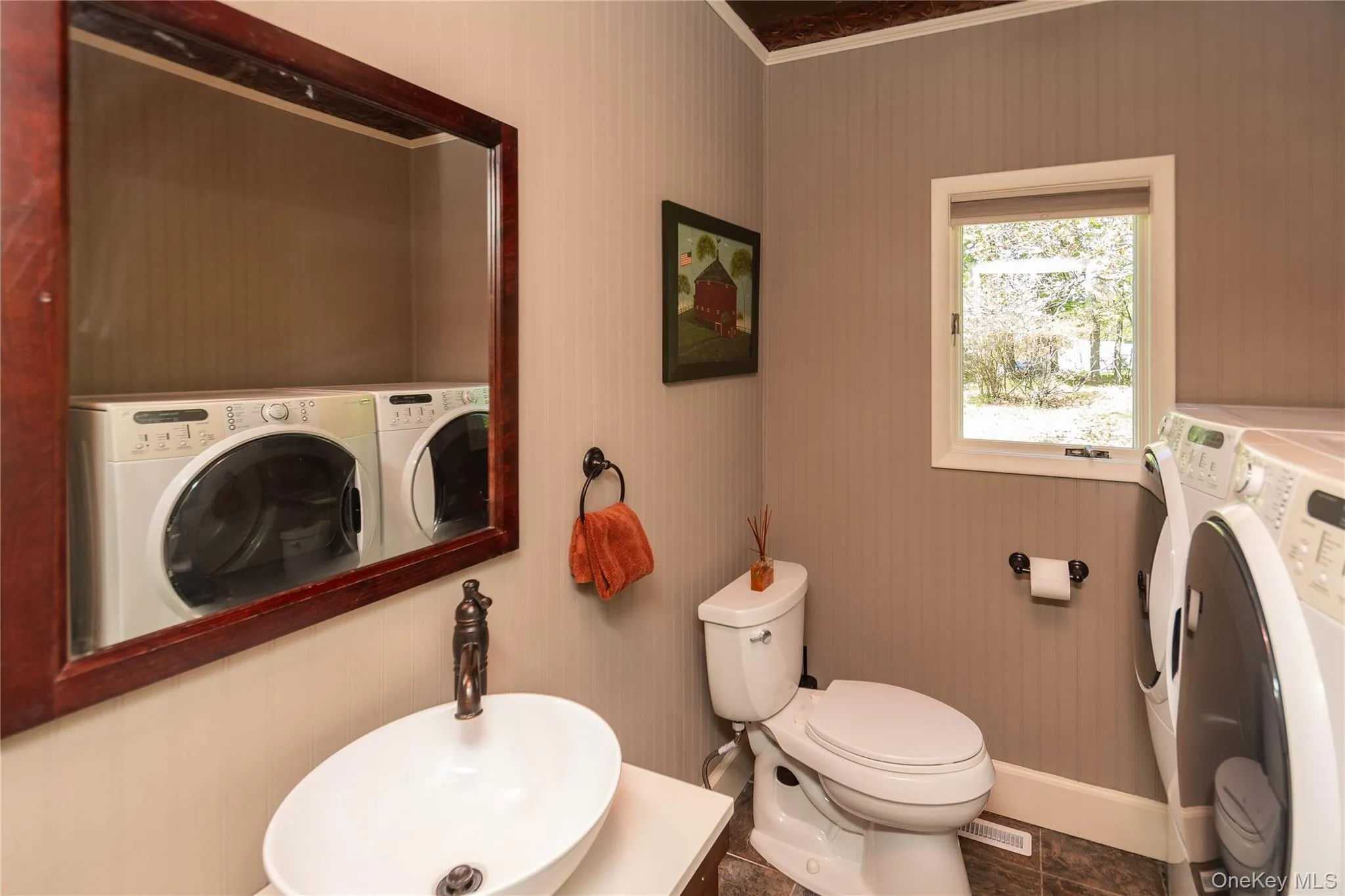 Half bathroom on first level with washer/dryer Half bathroom on first level with washer/dryer