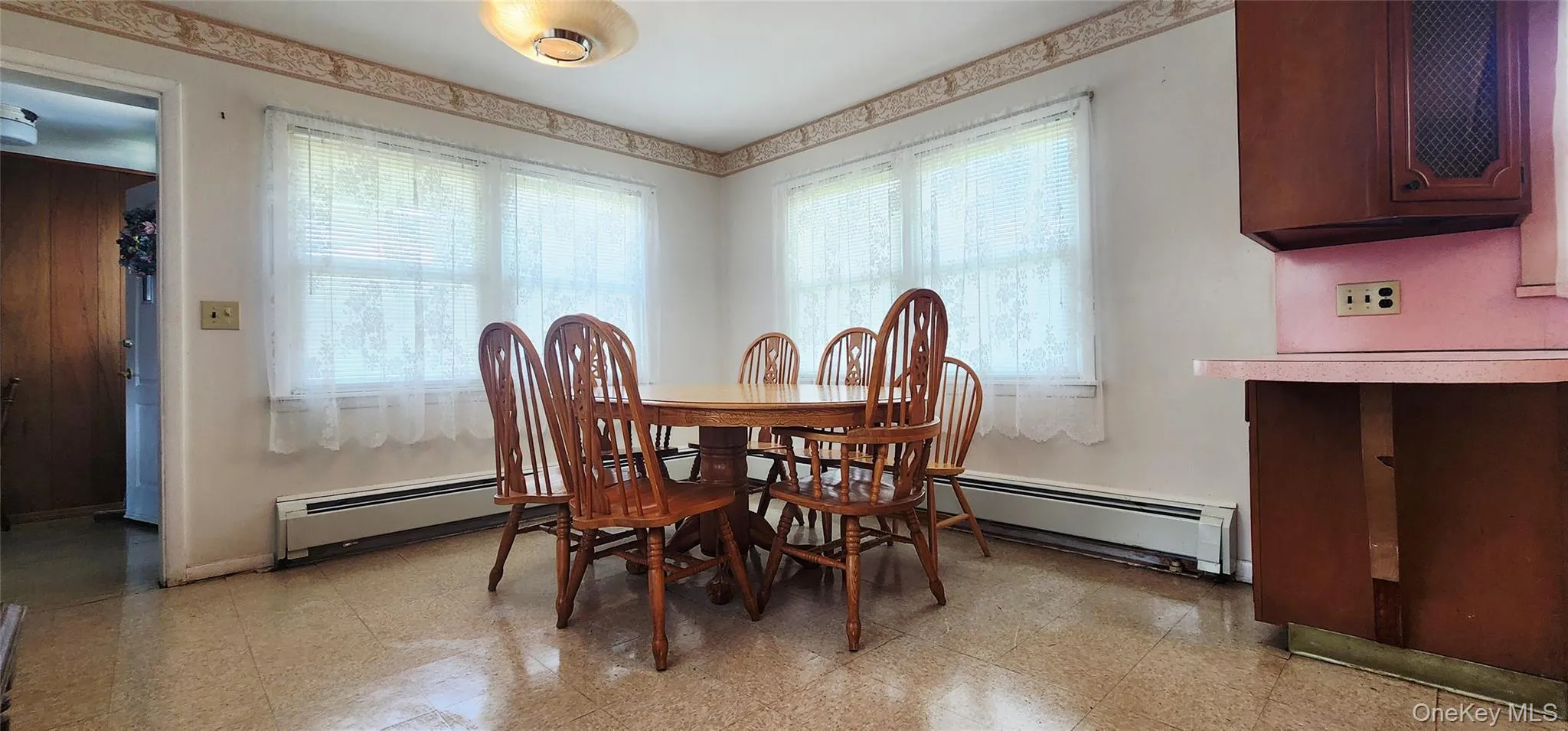 Dining area featuring healthy amount of natural light and granite tiled floors Dining area featuring healthy amount of natural light and granite tiled floors