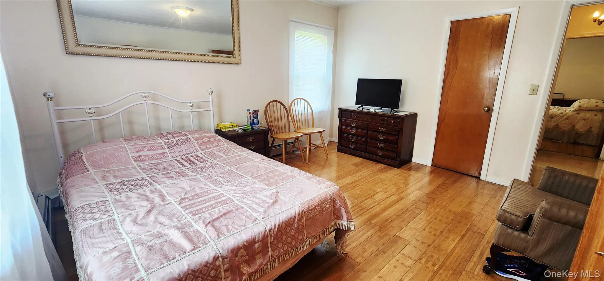 Bedroom featuring hardwood / wood-style floors Bedroom featuring hardwood / wood-style floors