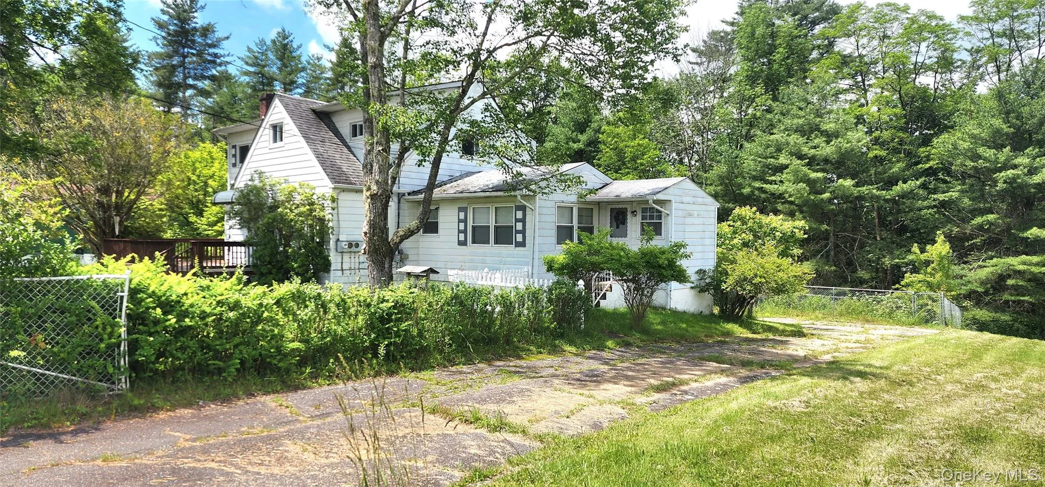 View of front of house with a shingled roof View of front of house with a shingled roof