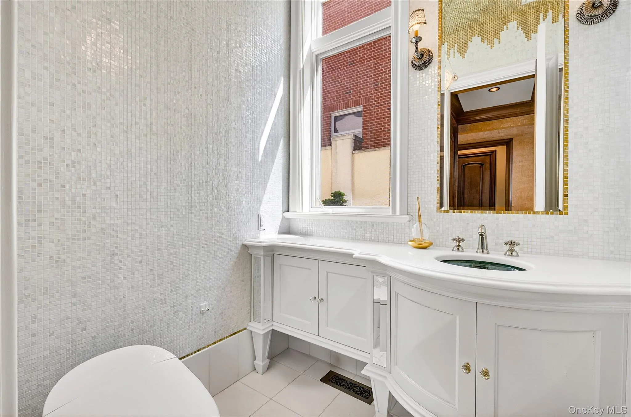 Bathroom with vanity and light tile patterned floors Bathroom with vanity and light tile patterned floors