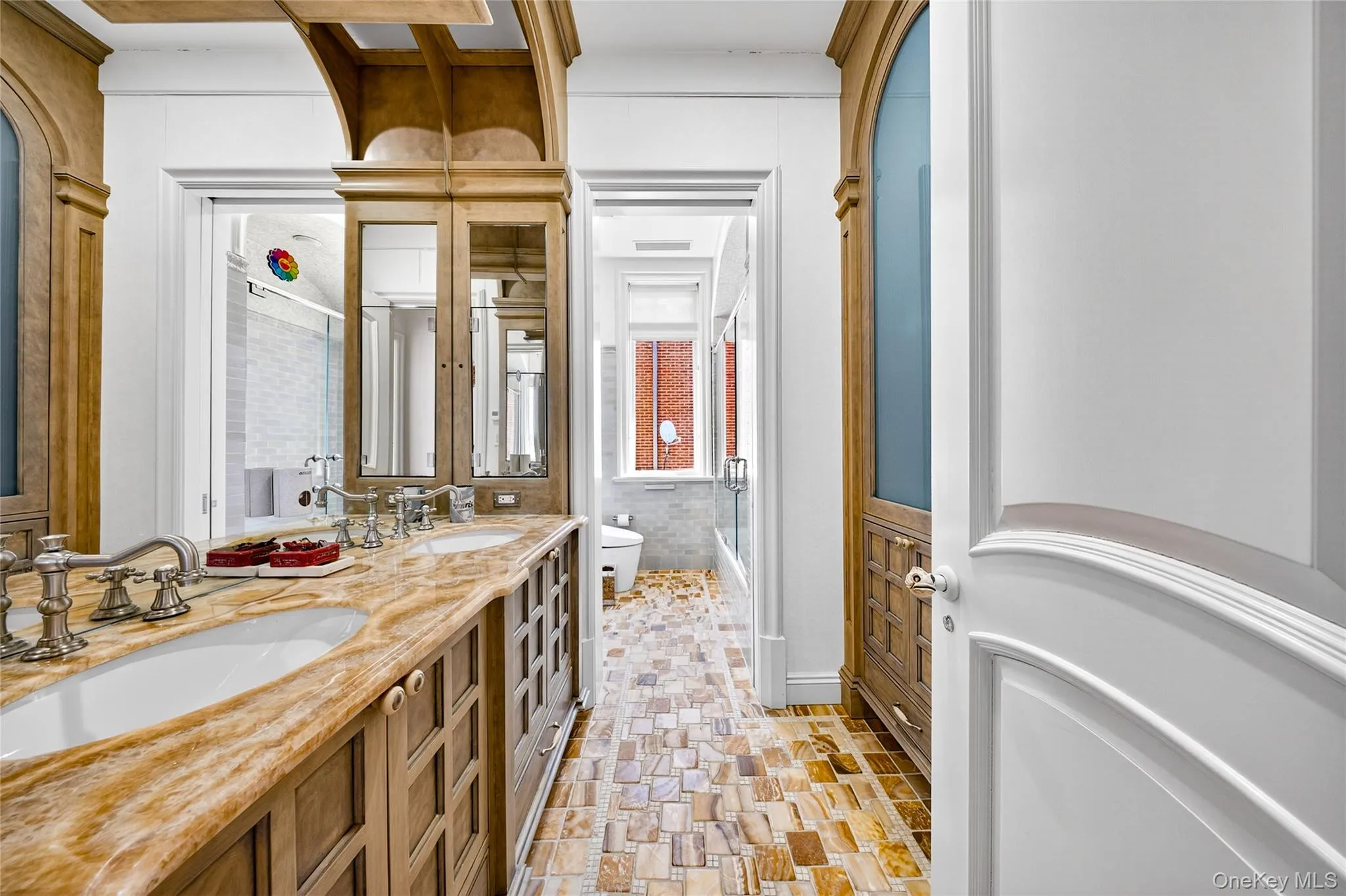 Bathroom with double vanity and an enclosed shower Bathroom with double vanity and an enclosed shower