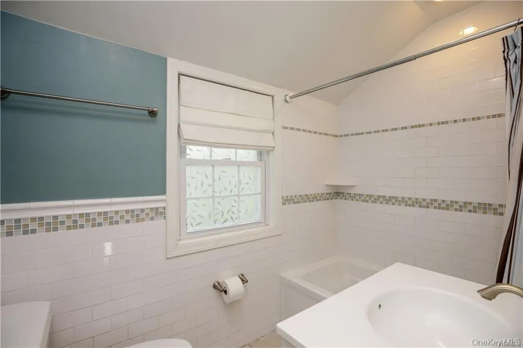 Beautifully renovated Hall Bathroom with combined shower and tub. Beautifully renovated Hall Bathroom with combined shower and tub.