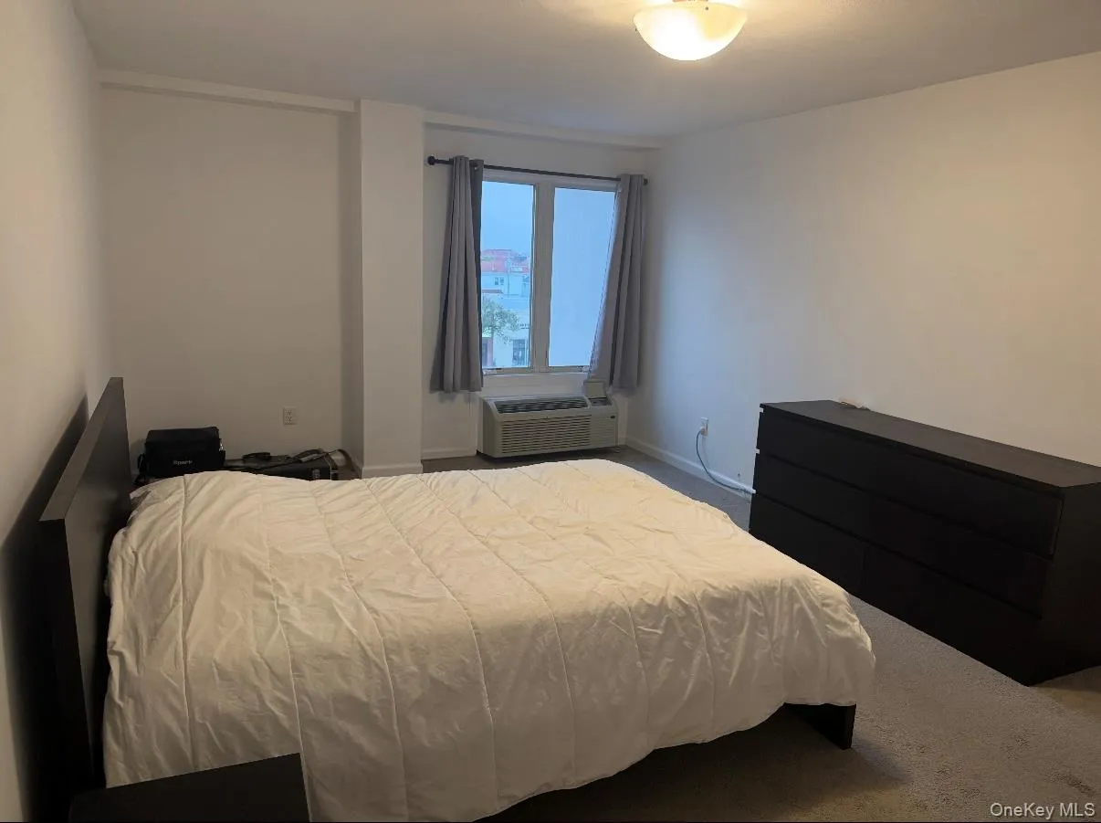 Bedroom featuring carpet floors and baseboards Bedroom featuring carpet floors and baseboards