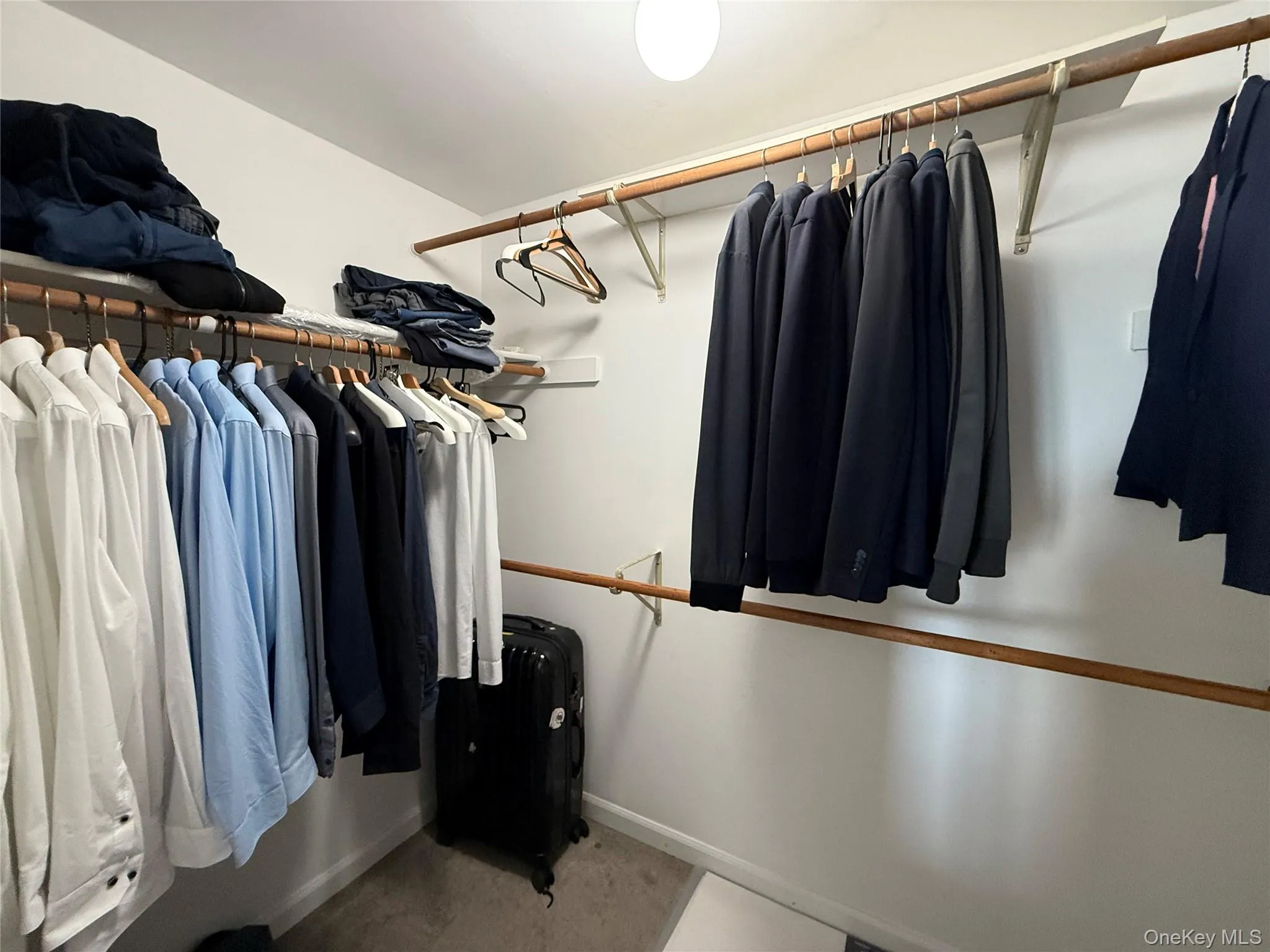 View of walk in closet View of walk in closet