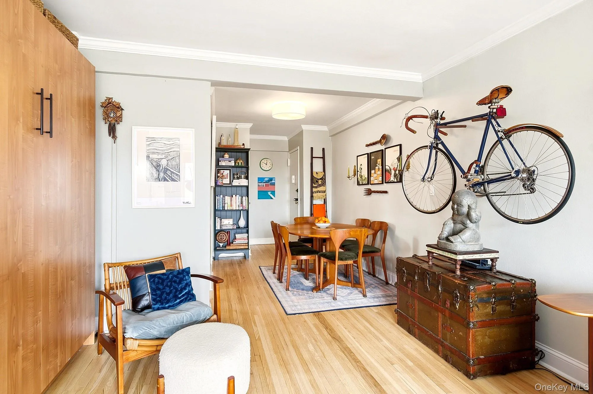 Large living room with hardwood floors open to a dining area Large living room with hardwood floors open to a dining area
