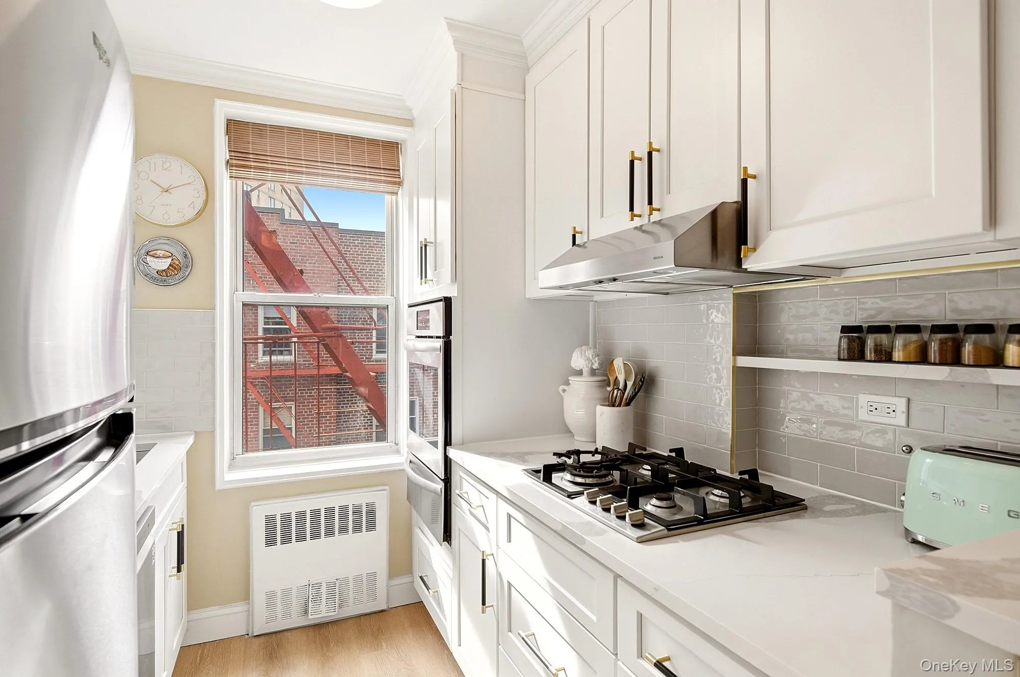 Fully renovated windowed kitchen with new shaker style cabinets, quartz counter tops and stainless steel appliances Fully renovated windowed kitchen with new shaker style cabinets, quartz counter tops and stainless steel appliances