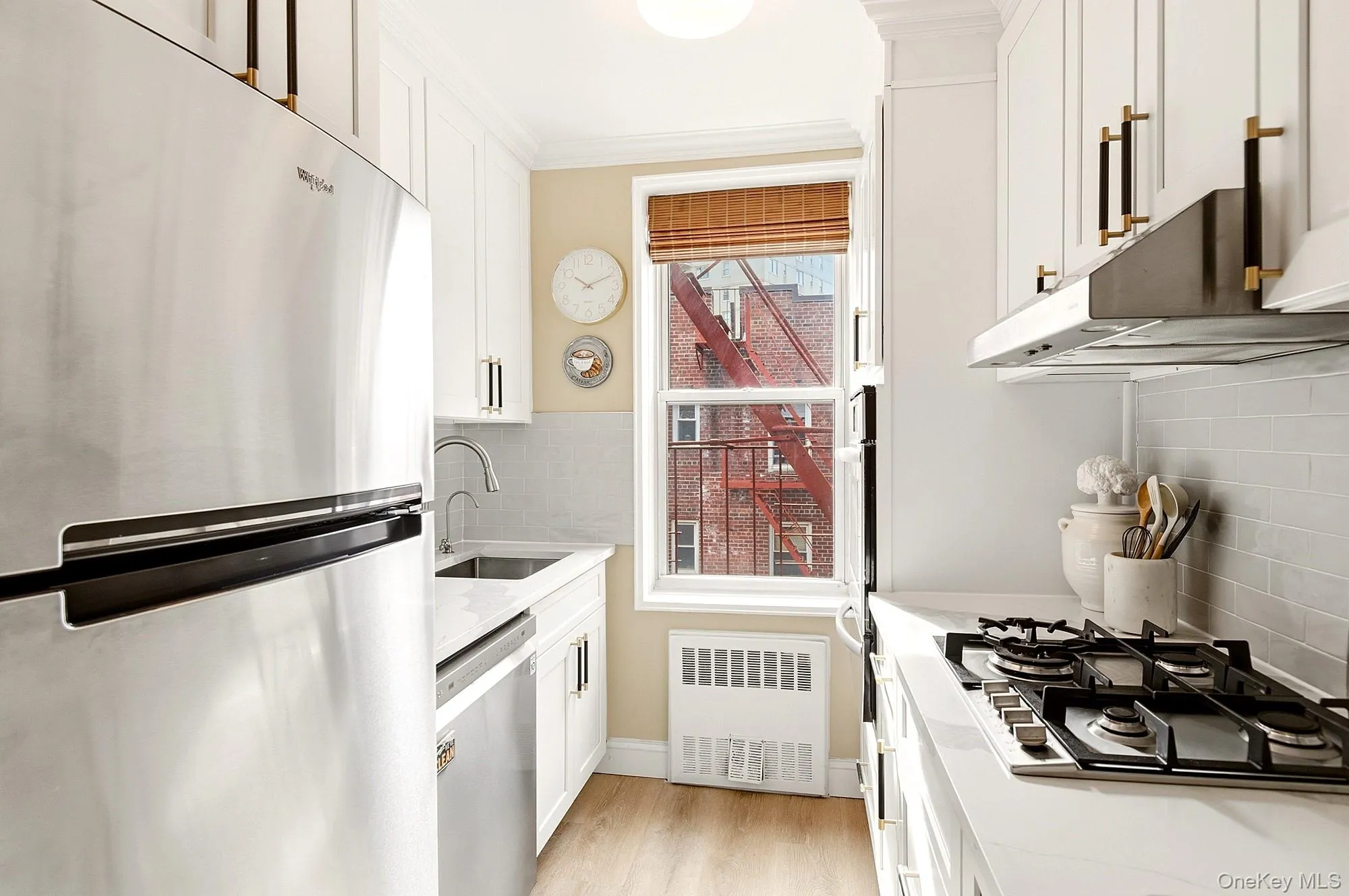 Fully renovated windowed kitchen with new shaker style cabinets, quartz counter tops and stainless steel appliances Fully renovated windowed kitchen with new shaker style cabinets, quartz counter tops and stainless steel appliances