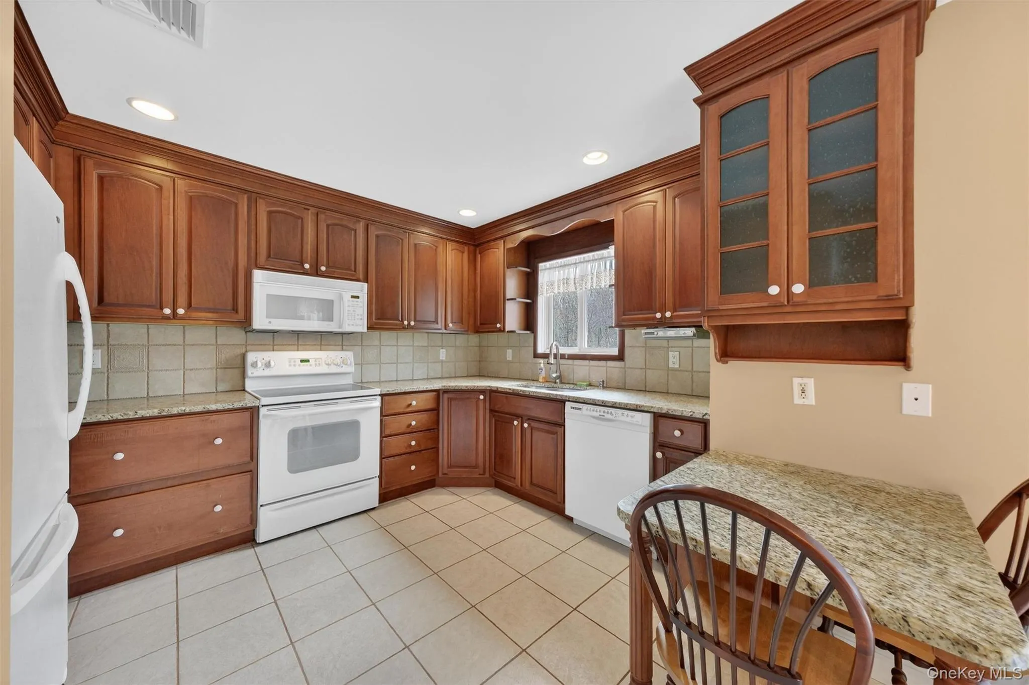 Kitchen with small eat-in counter. Kitchen with small eat-in counter.