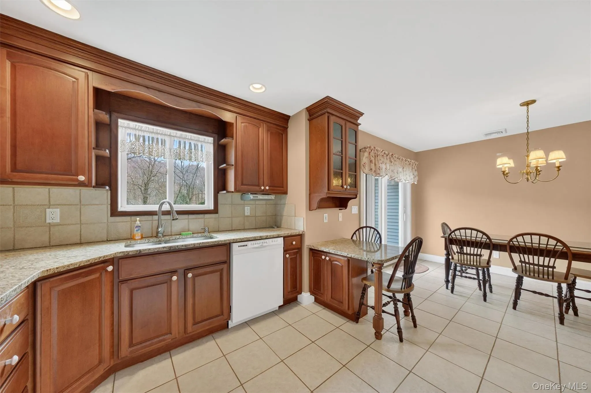Kitchen with 2-person counter plus Dining area. Kitchen with 2-person counter plus Dining area.