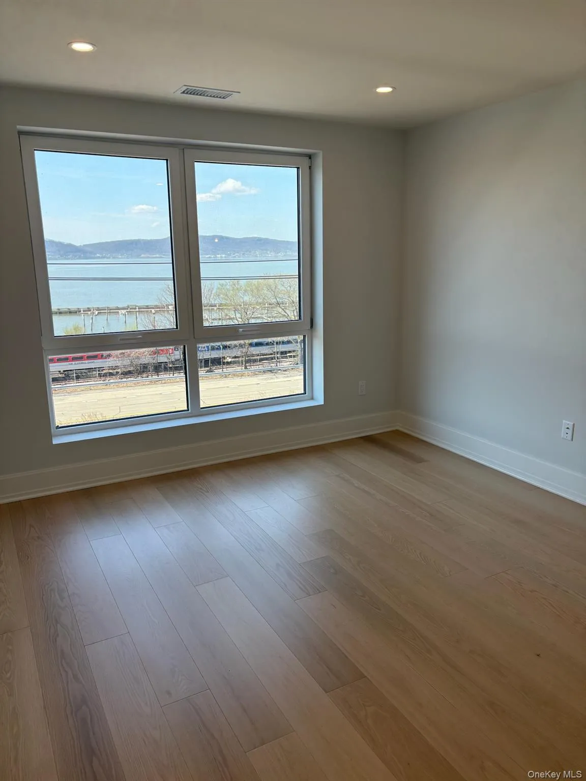 Bedroom with stunning views of the Hudson River. Bedroom with stunning views of the Hudson River.