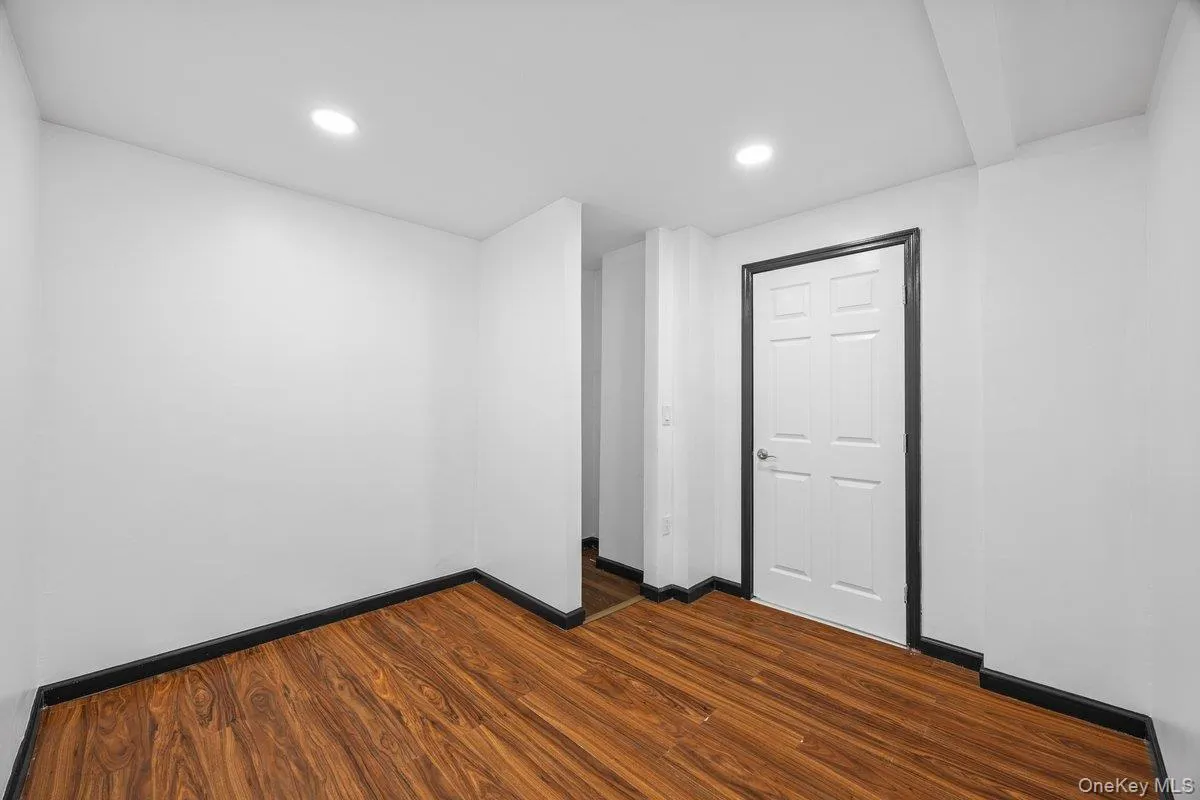 This room features wood-look flooring and bright recessed lighting This room features wood-look flooring and bright recessed lighting