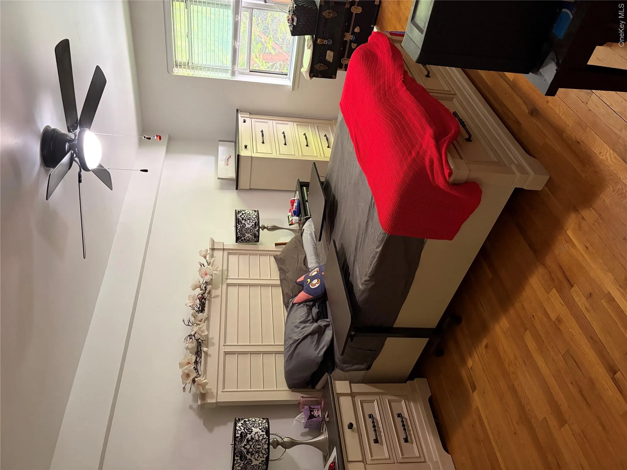 Spacious bedroom, with large windows, double closets, and hardwood-style flooring throughout Spacious bedroom, with large windows, double closets, and hardwood-style flooring throughout