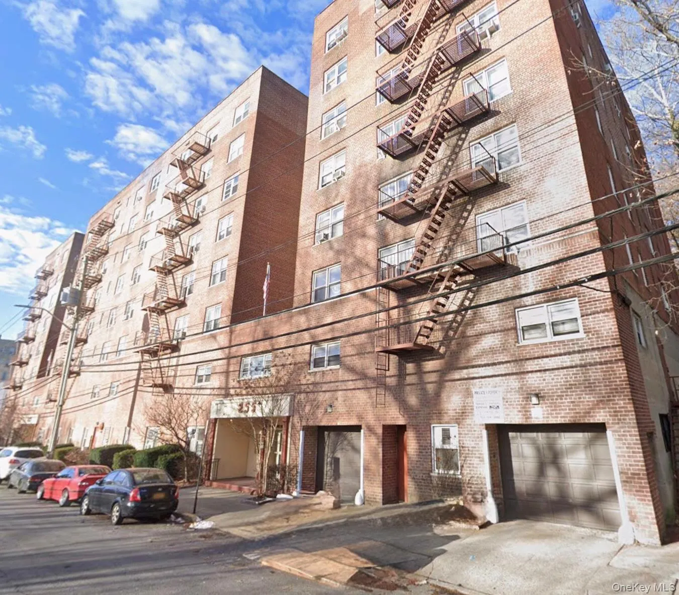 Multi-story brick building with multiple fire escapes Multi-story brick building with multiple fire escapes