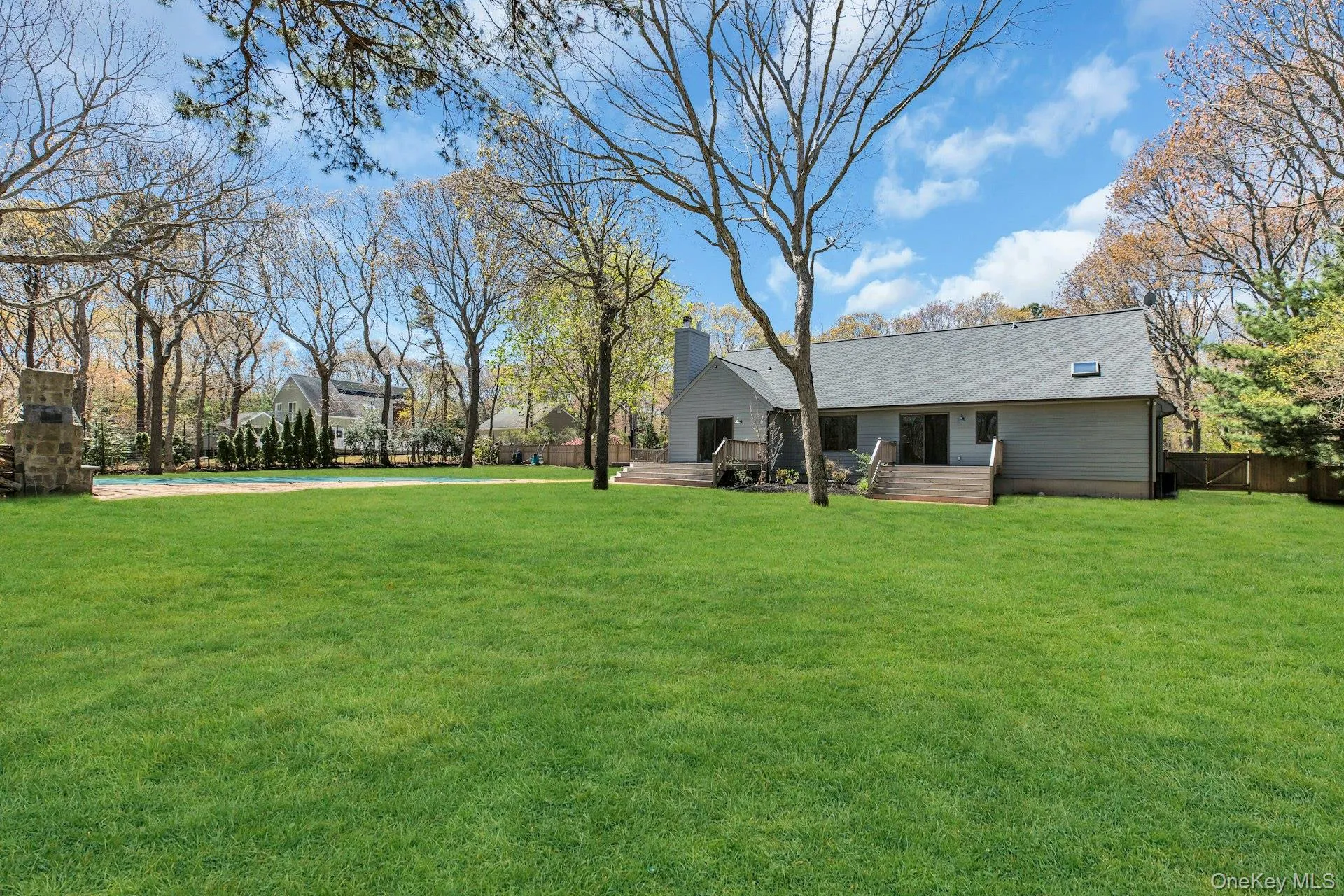 Expansive green lawn with mature trees Expansive green lawn with mature trees