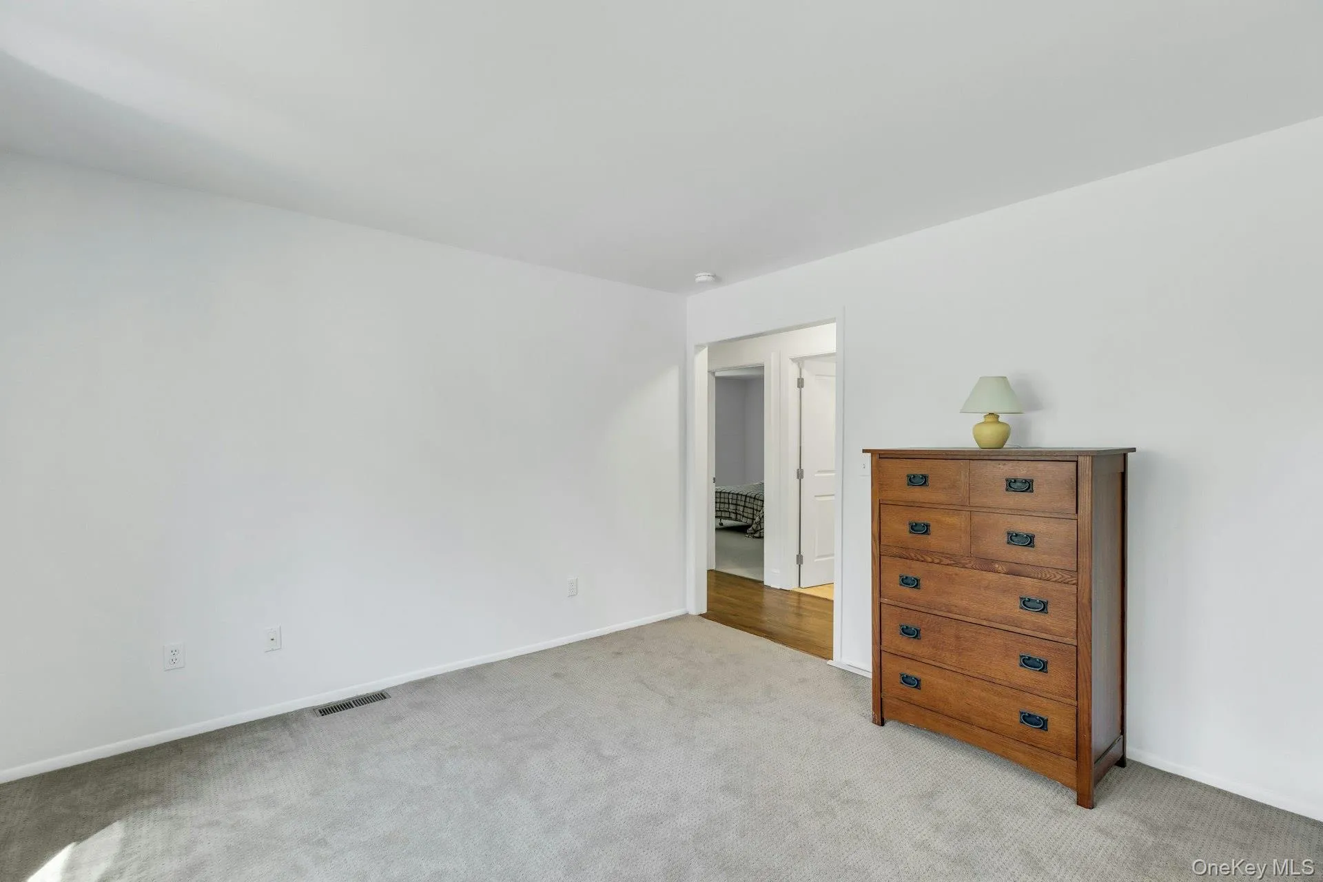 Wall-to-wall carpeting in a neutral tone and white wall paint throughout Wall-to-wall carpeting in a neutral tone and white wall paint throughout