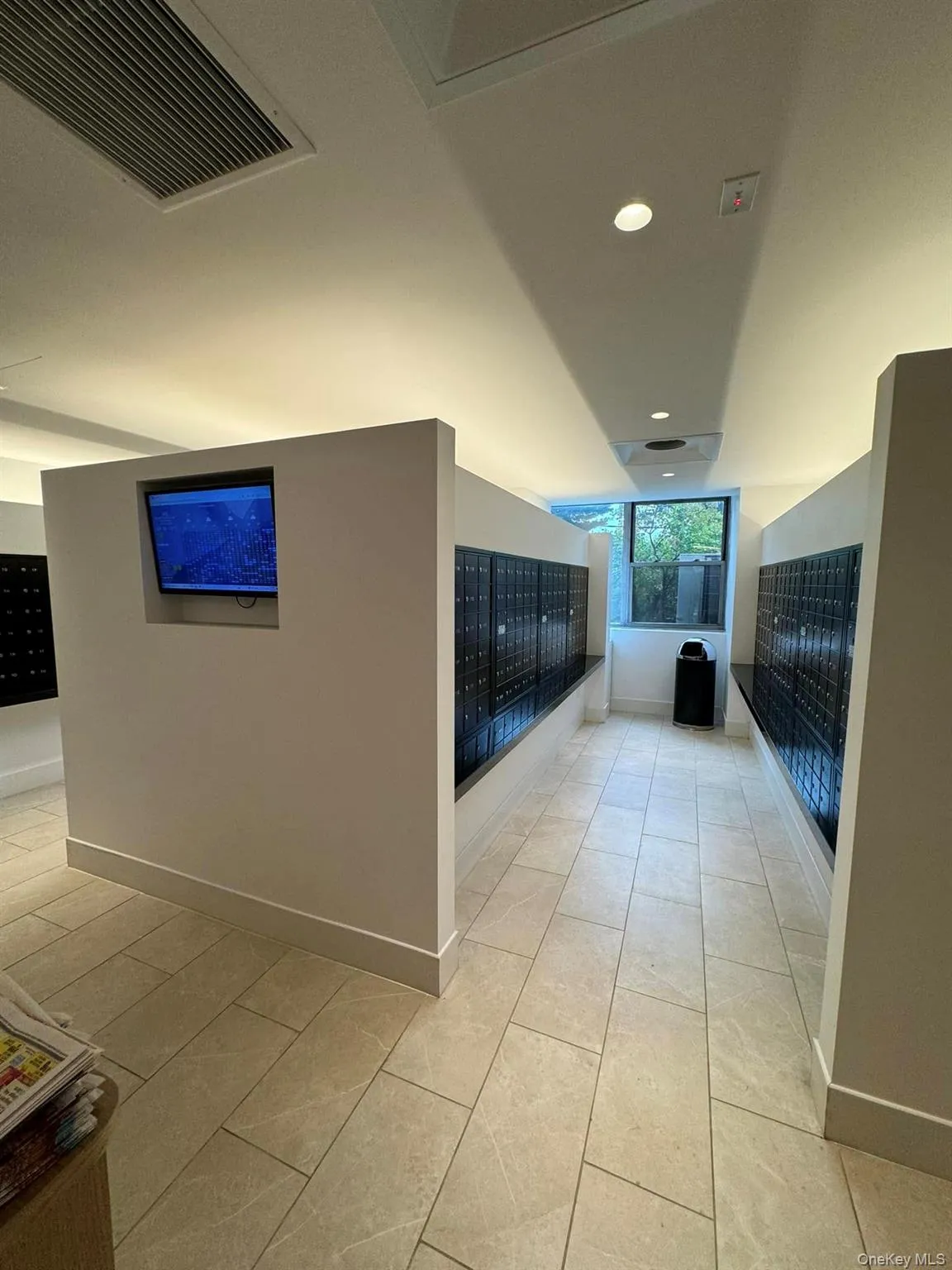Hallway with mail area, recessed lighting, and tile patterned floors Hallway with mail area, recessed lighting, and tile patterned floors