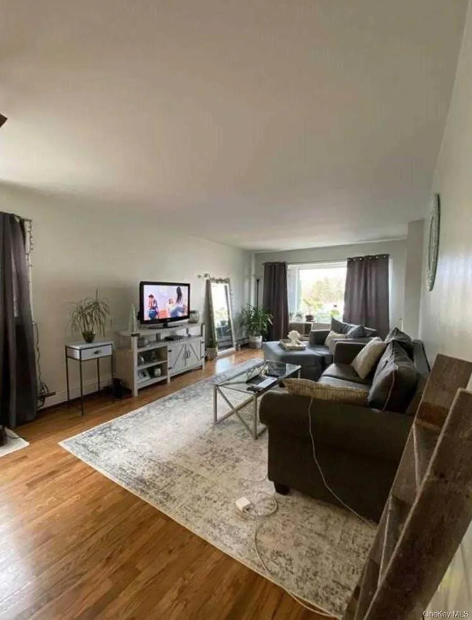 Living area featuring wood finished floors Living area featuring wood finished floors