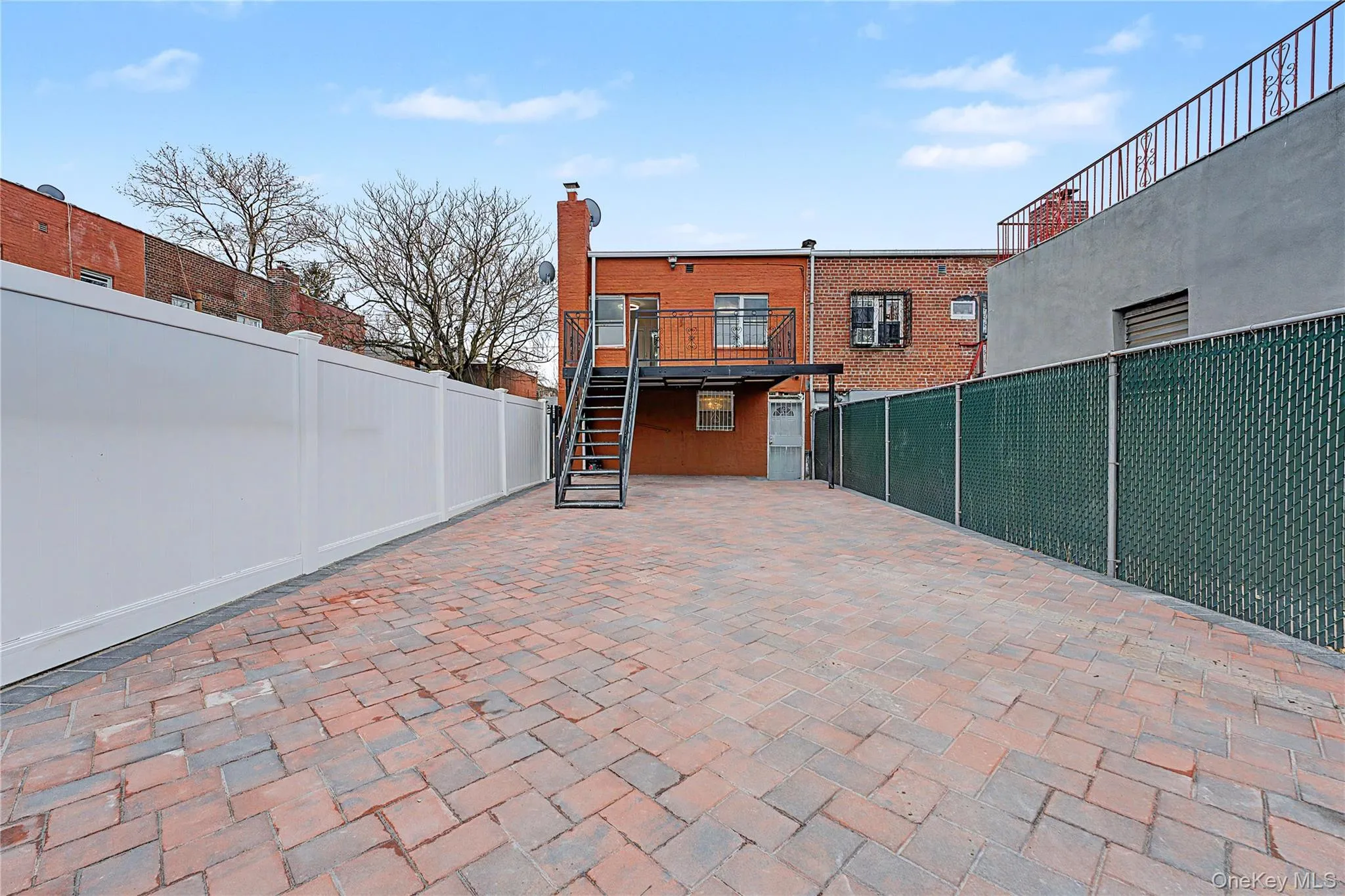 Brand new fully pavered large backyard with newly installed fence and gate Brand new fully pavered large backyard with newly installed fence and gate