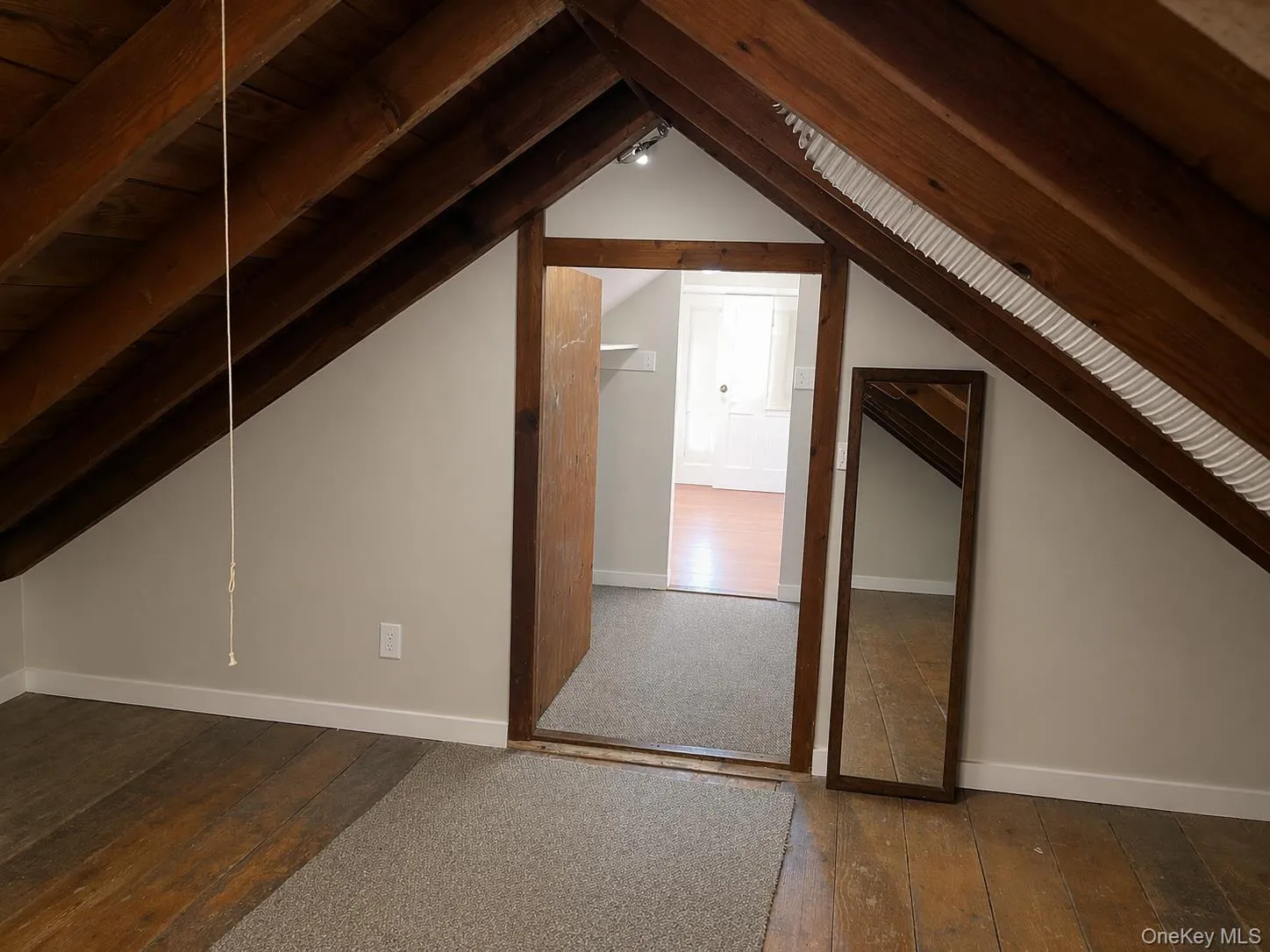 additional space with access from the primary bedroom closet additional space with access from the primary bedroom closet