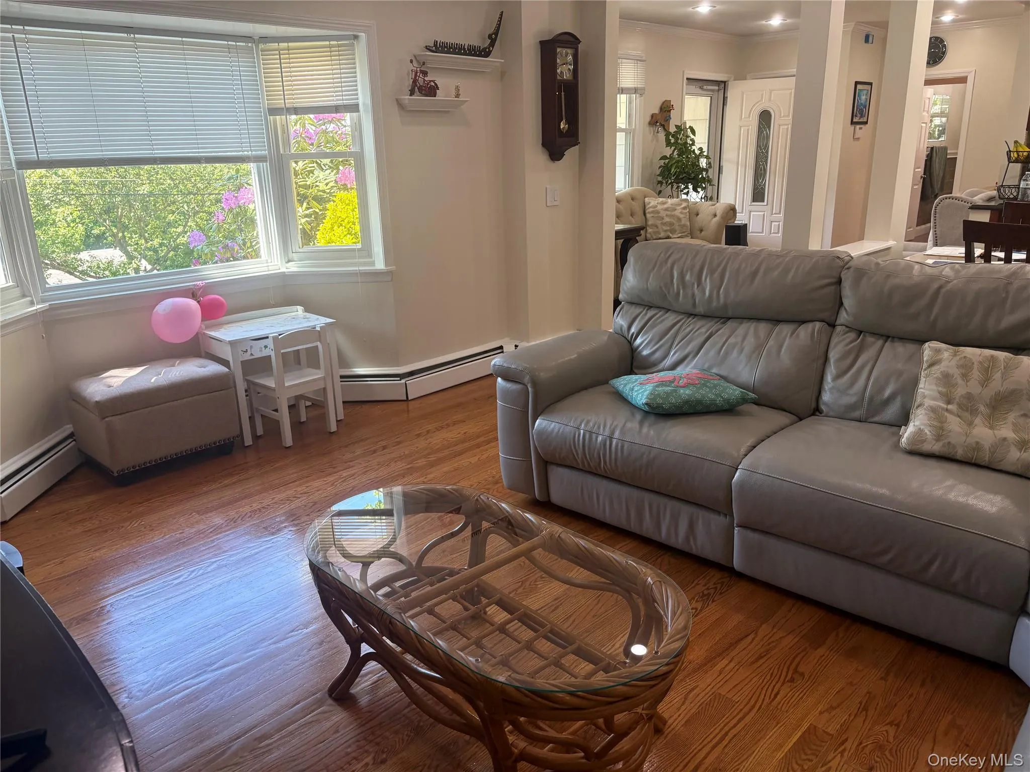 Very Bright Living area featuring wood-finish flooring, white baseboards. Very Bright Living area featuring wood-finish flooring, white baseboards.