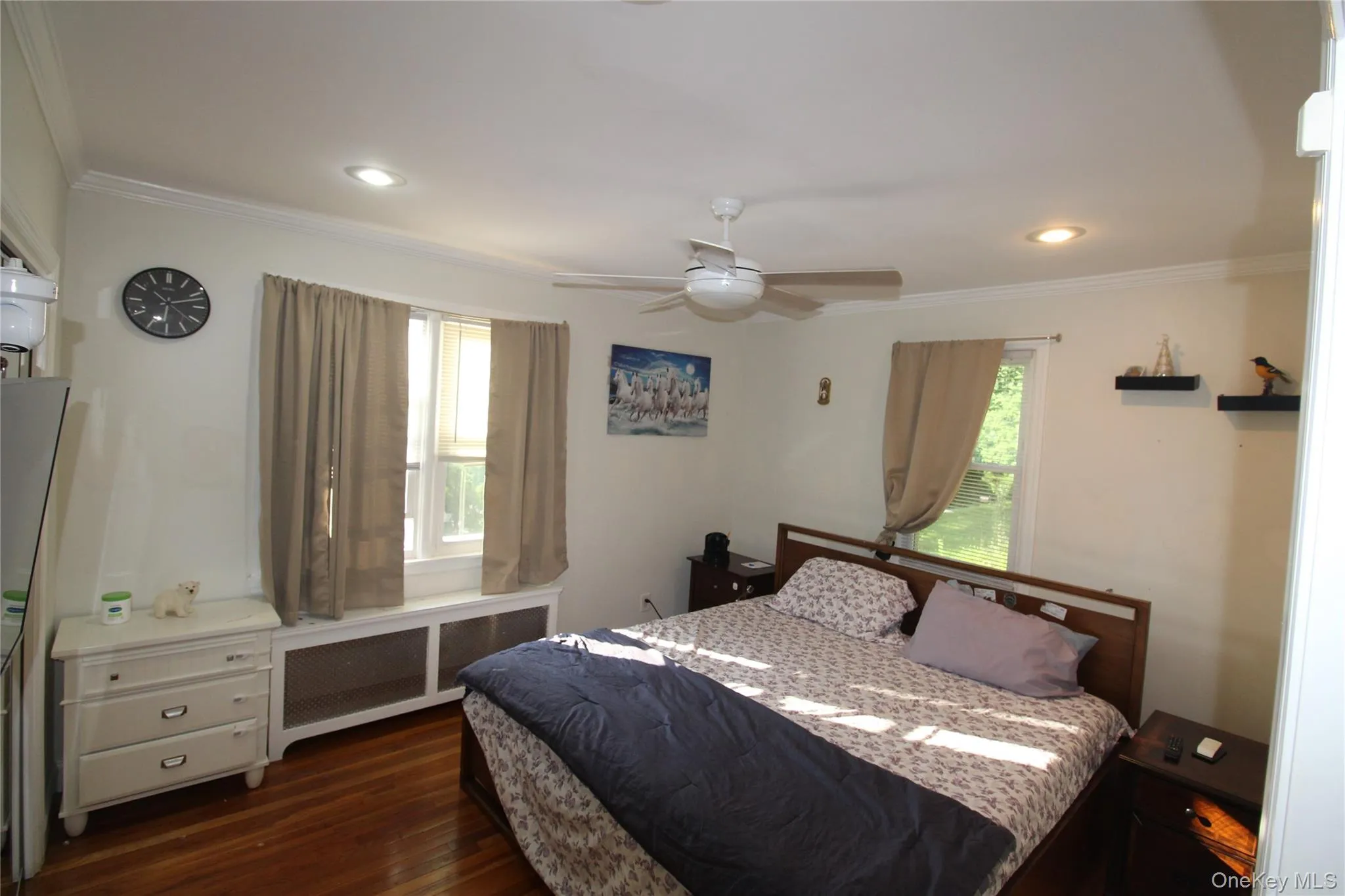 2nd Bedroom offers Wood-finish flooring with crown molding and recessed lighting. 2nd Bedroom offers Wood-finish flooring with crown molding and recessed lighting.