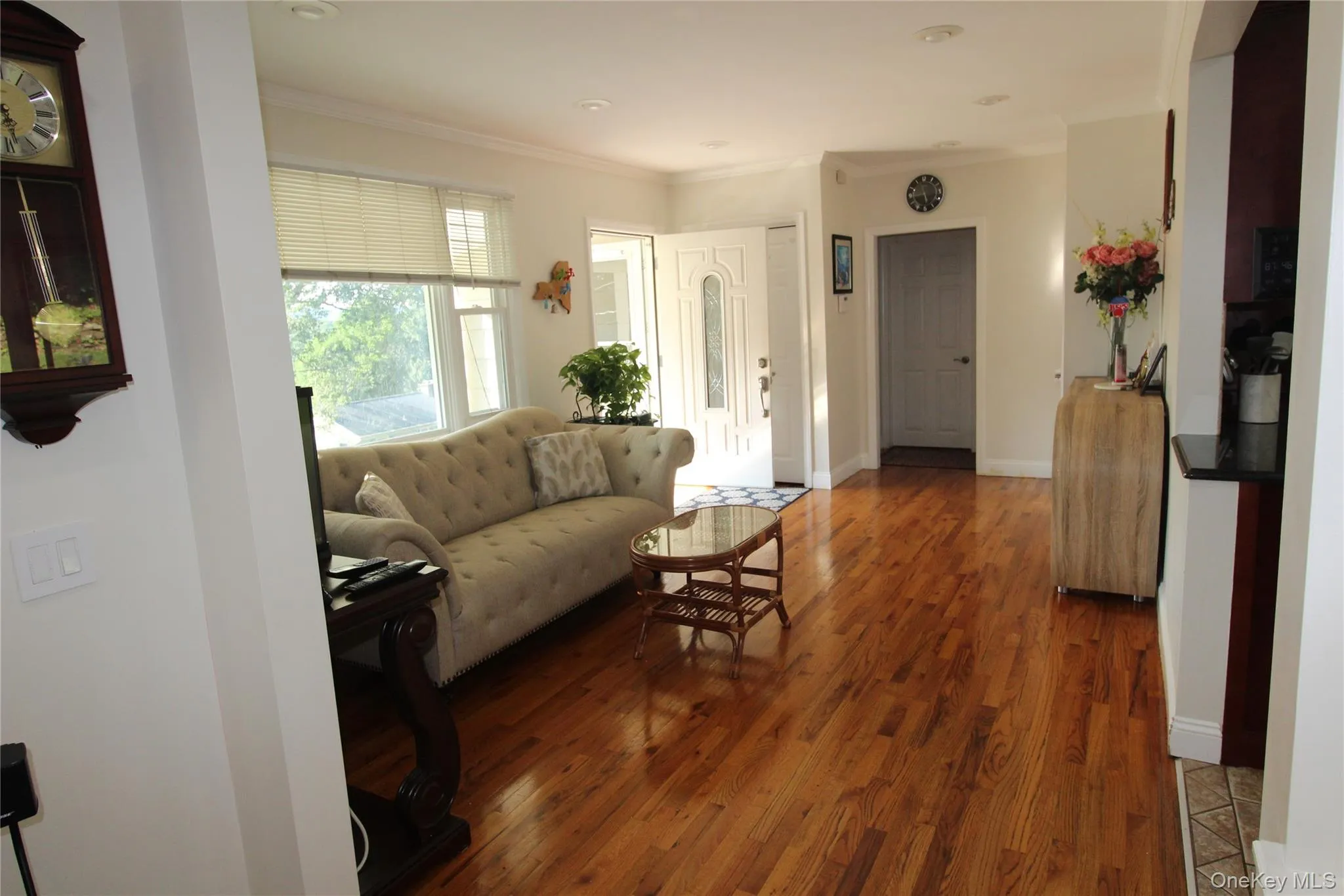Wood-finish flooring throughout, crown molding, and recessed lighting. Wood-finish flooring throughout, crown molding, and recessed lighting.