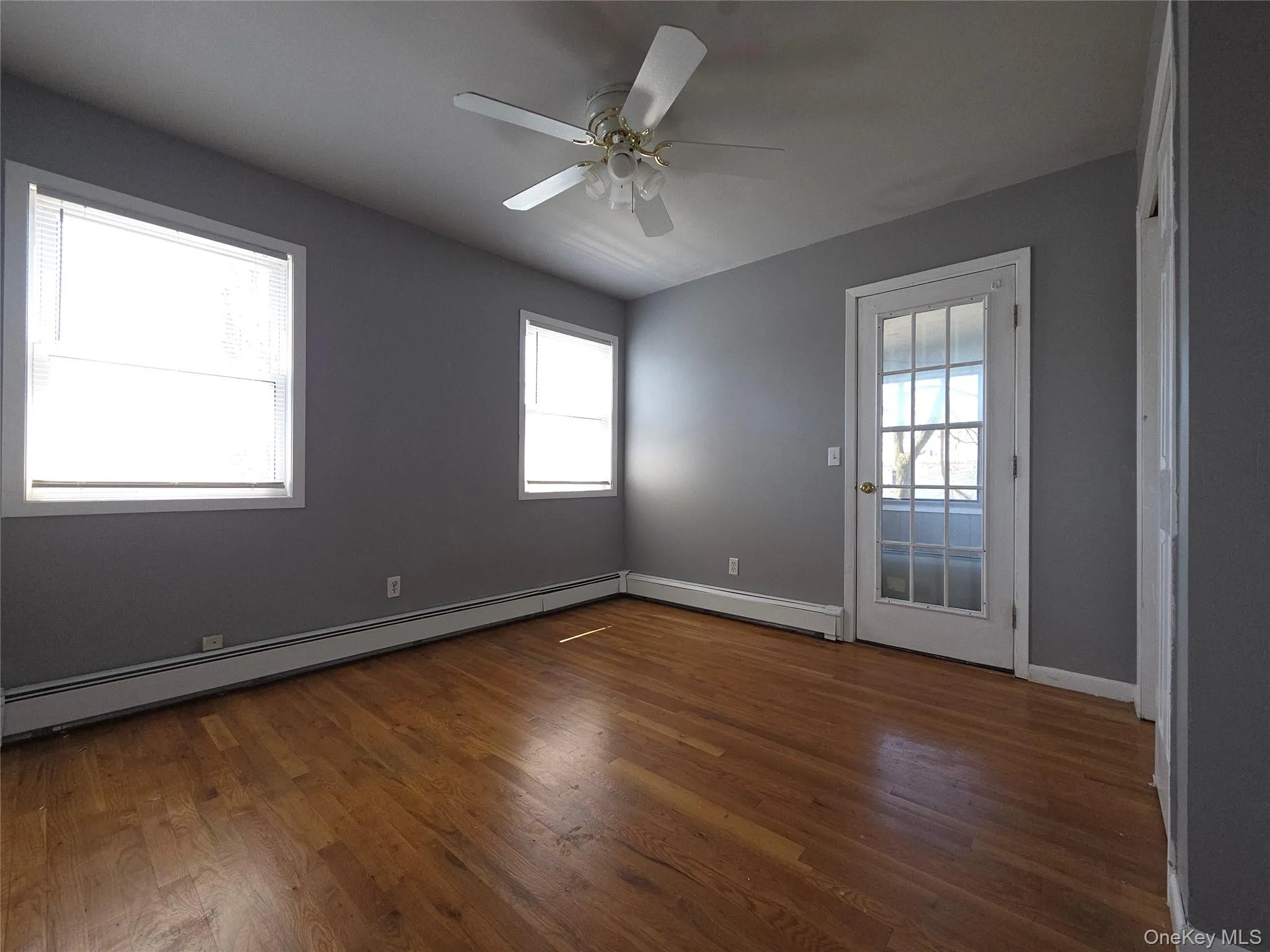 Second bedroom with door to back screened and covered deck. Second bedroom with door to back screened and covered deck.