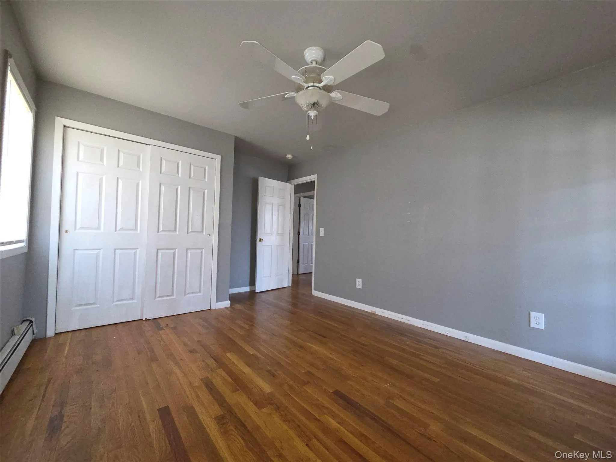 Primary bedroom with nice size closet and ceiling fan. Primary bedroom with nice size closet and ceiling fan.