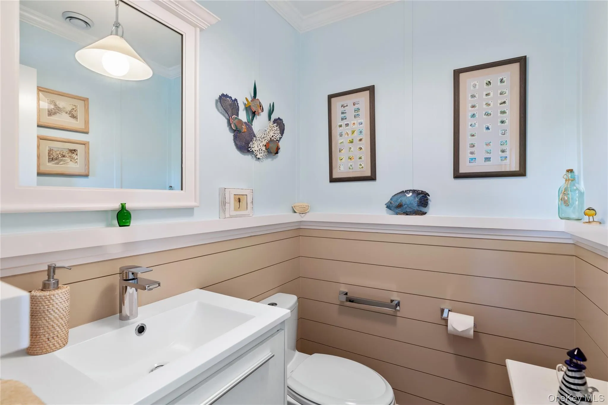 Half Bathroom (1st Floor) featuring ornamental molding, vanity, and toilet Half Bathroom (1st Floor) featuring ornamental molding, vanity, and toilet