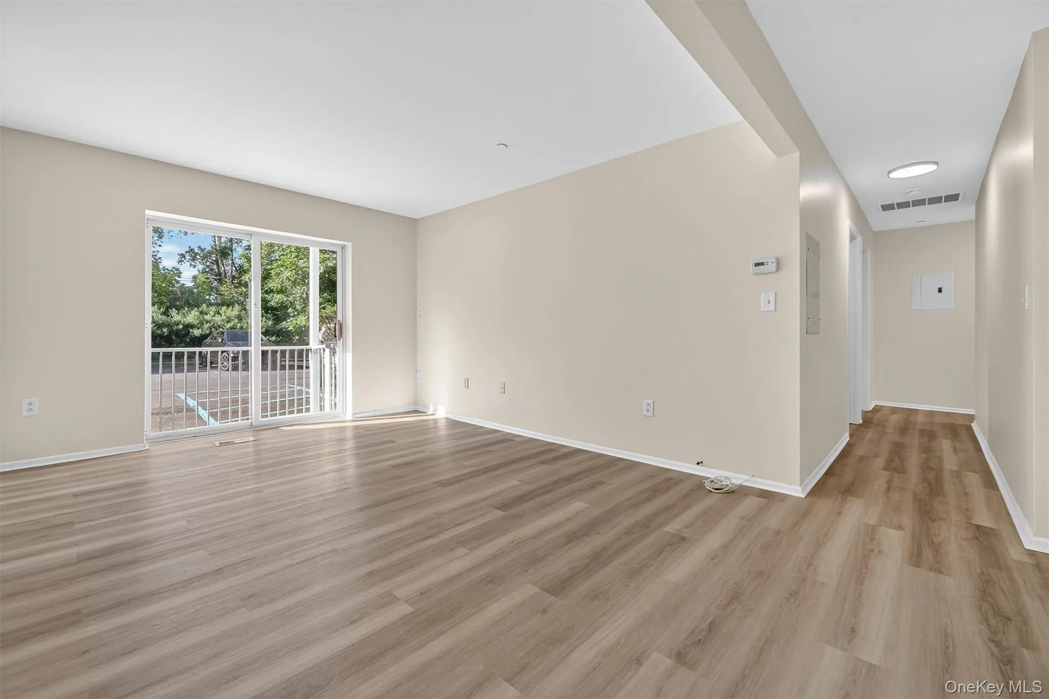 Spare room featuring light wood-style flooring and baseboards Spare room featuring light wood-style flooring and baseboards