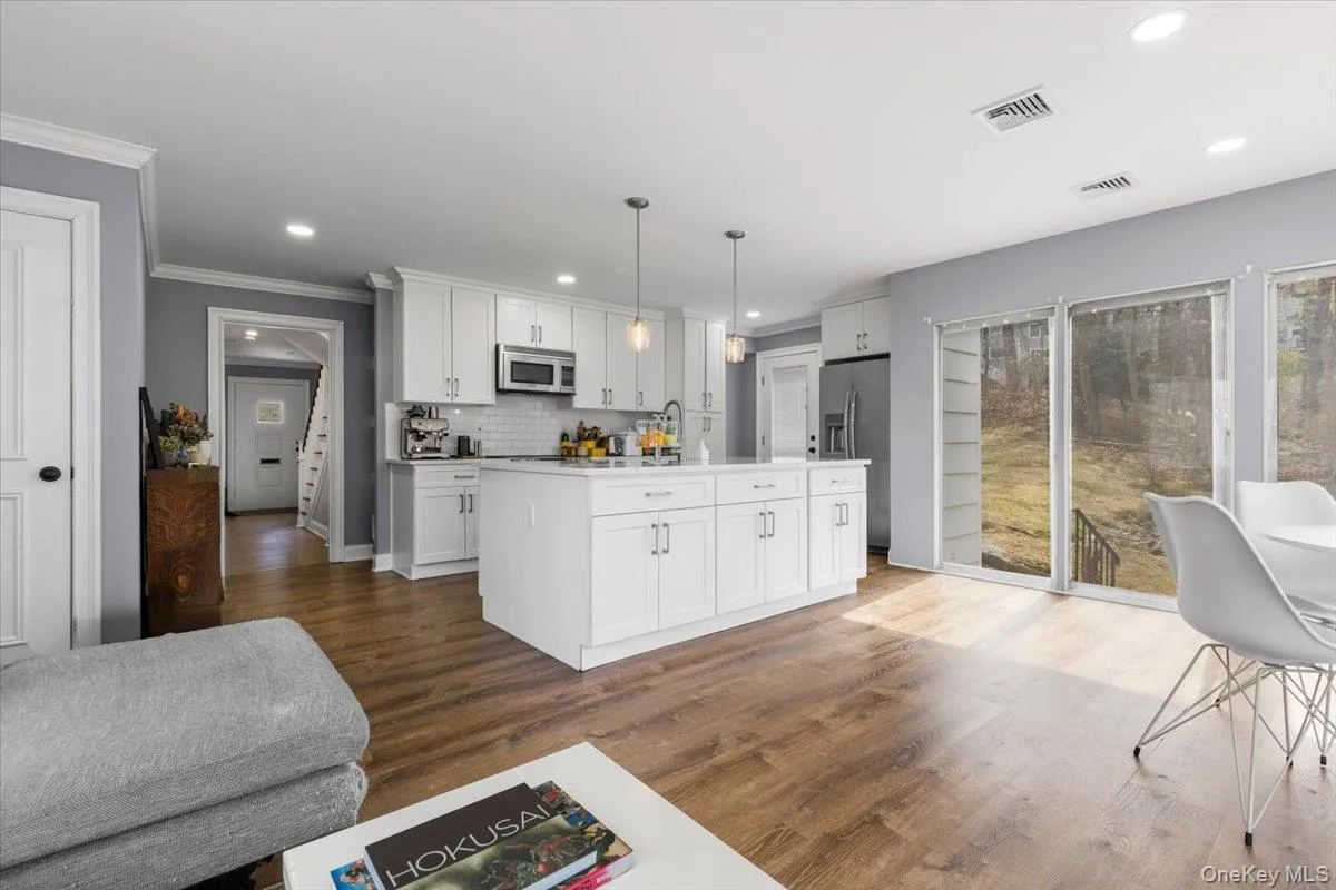 Family Room view towards center island in Kitchen. Family Room view towards center island in Kitchen.