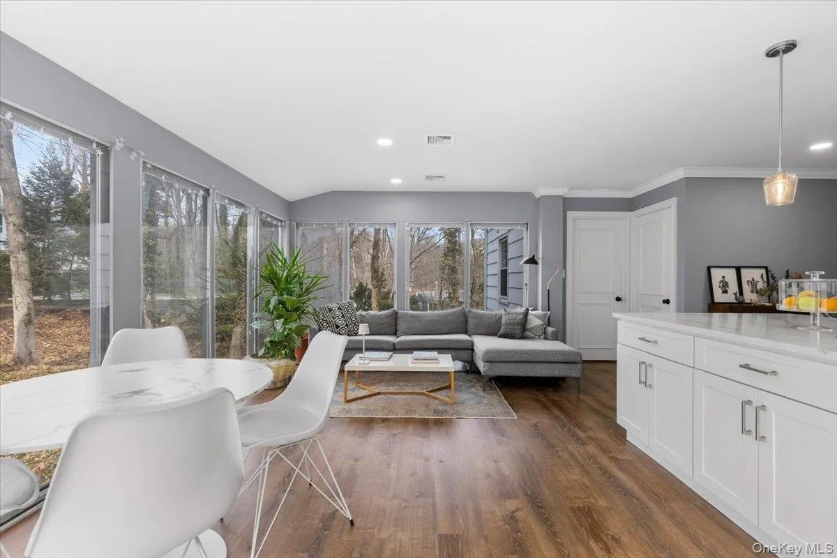 Family Room features three exposures with walls of windows. Family Room features three exposures with walls of windows.