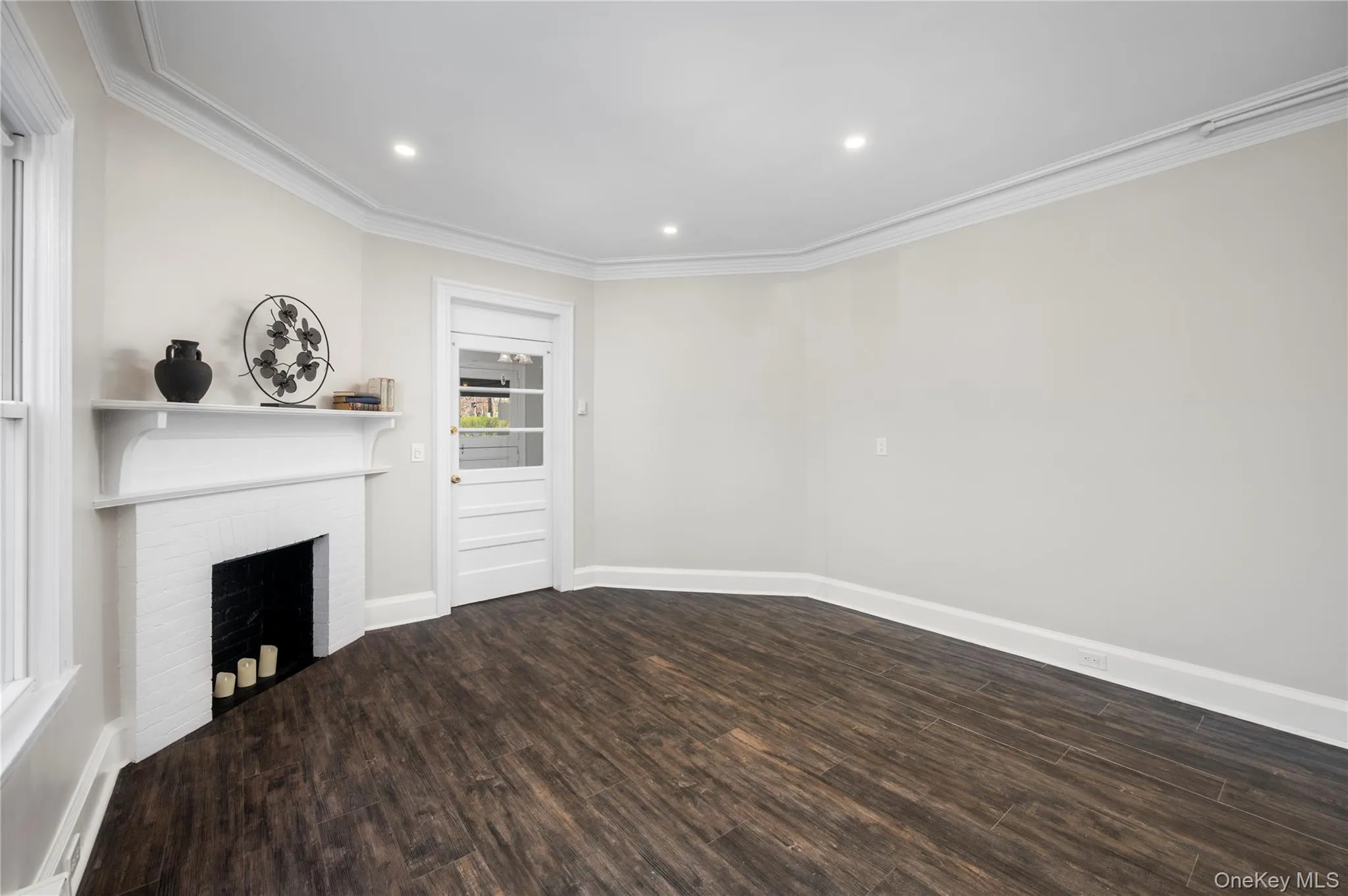 Main entrance to the living room area with recessed lighting Main entrance to the living room area with recessed lighting