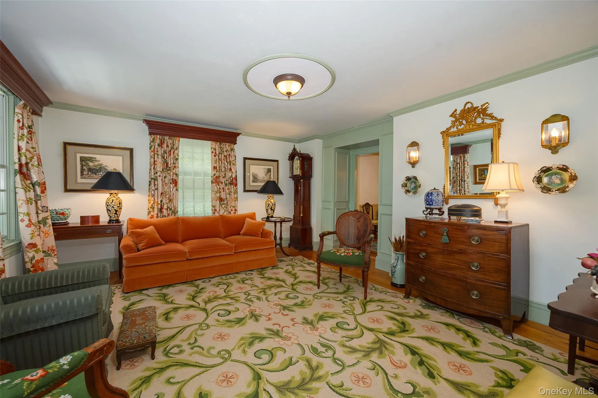 Inviting interior space featuring hardwood flooring, and built-ins Inviting interior space featuring hardwood flooring, and built-ins