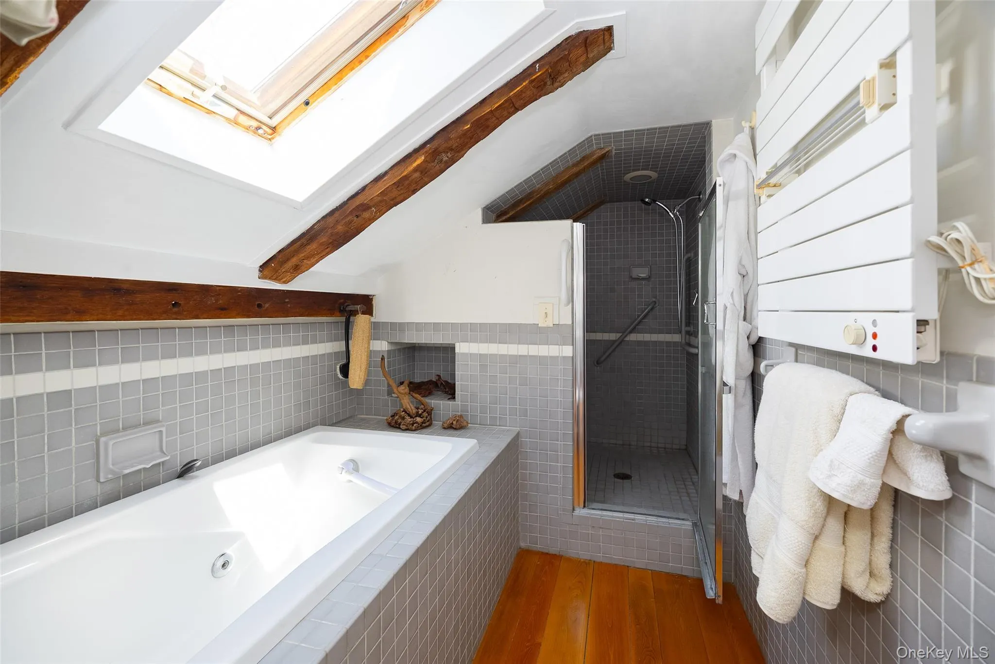 Tiled walk-in shower with integrated bench seating Tiled walk-in shower with integrated bench seating