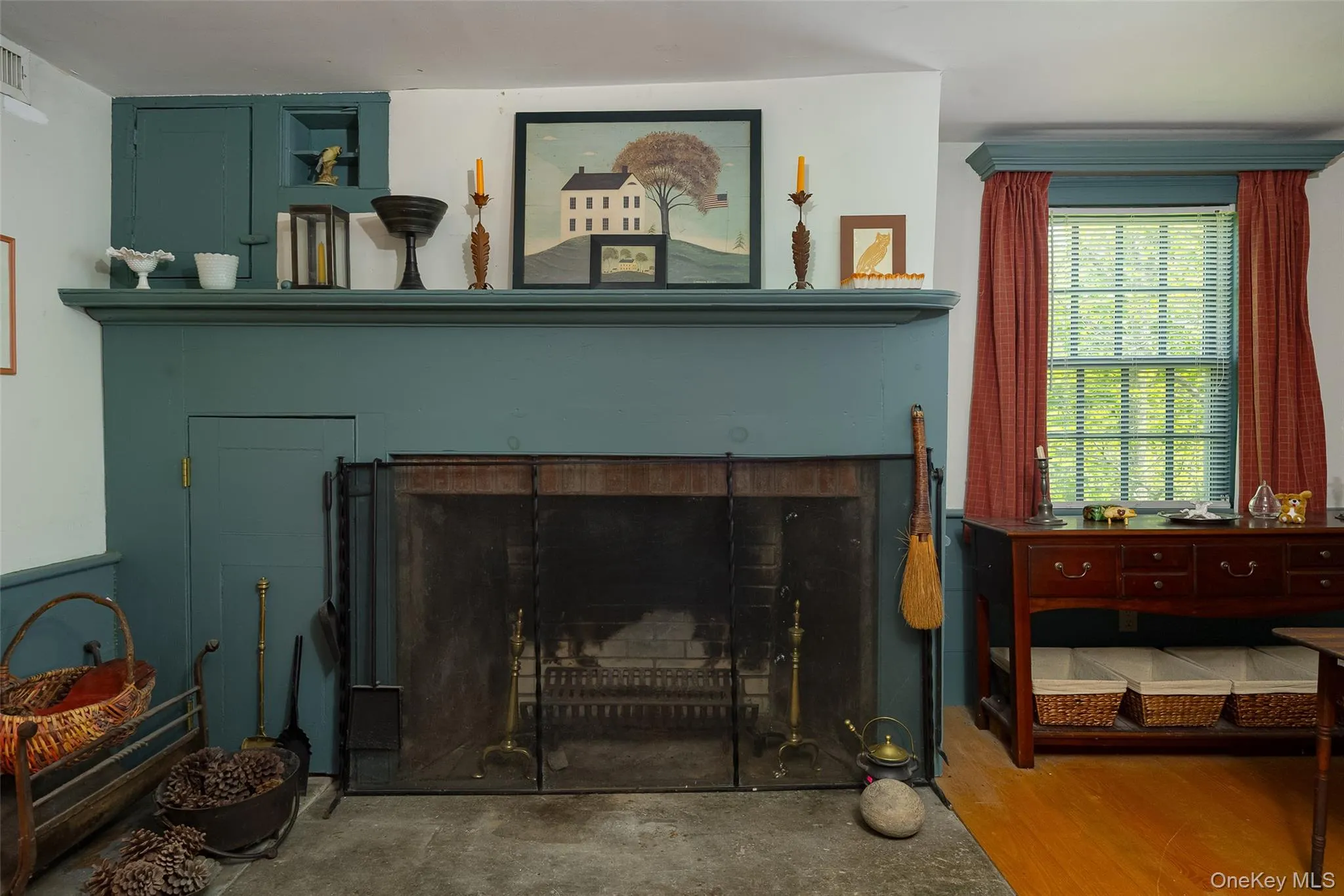 Original fireplace with a stone hearth and integrated storage Original fireplace with a stone hearth and integrated storage