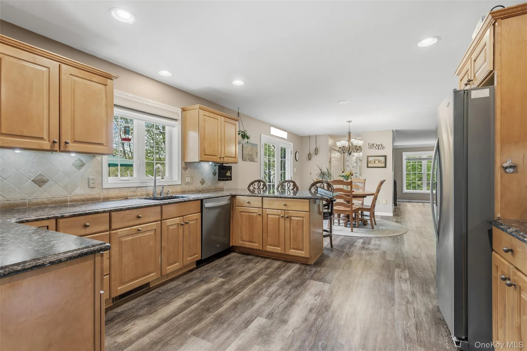 Eat-in kitchen with breakfast bar, with new stainless steel appliances, and granite counters Eat-in kitchen with breakfast bar, with new stainless steel appliances, and granite counters