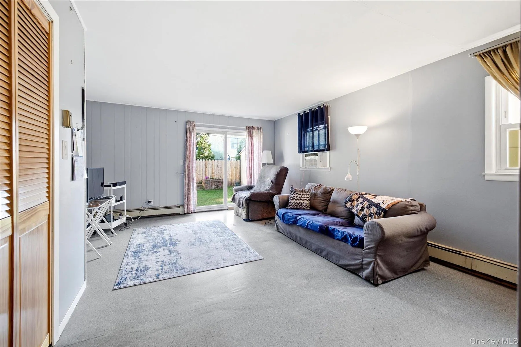 Spacious Den area with sliding glass doors to backyard Spacious Den area with sliding glass doors to backyard
