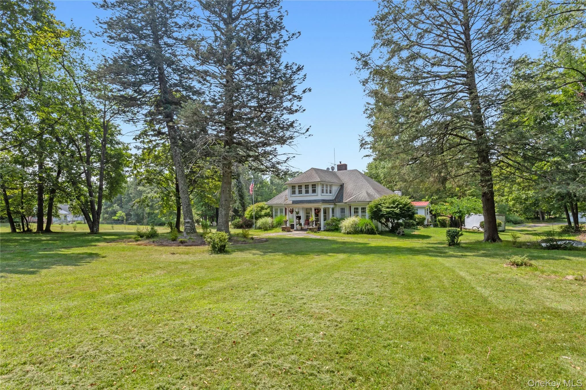 View of grassy yard featuring view of scattered trees View of grassy yard featuring view of scattered trees