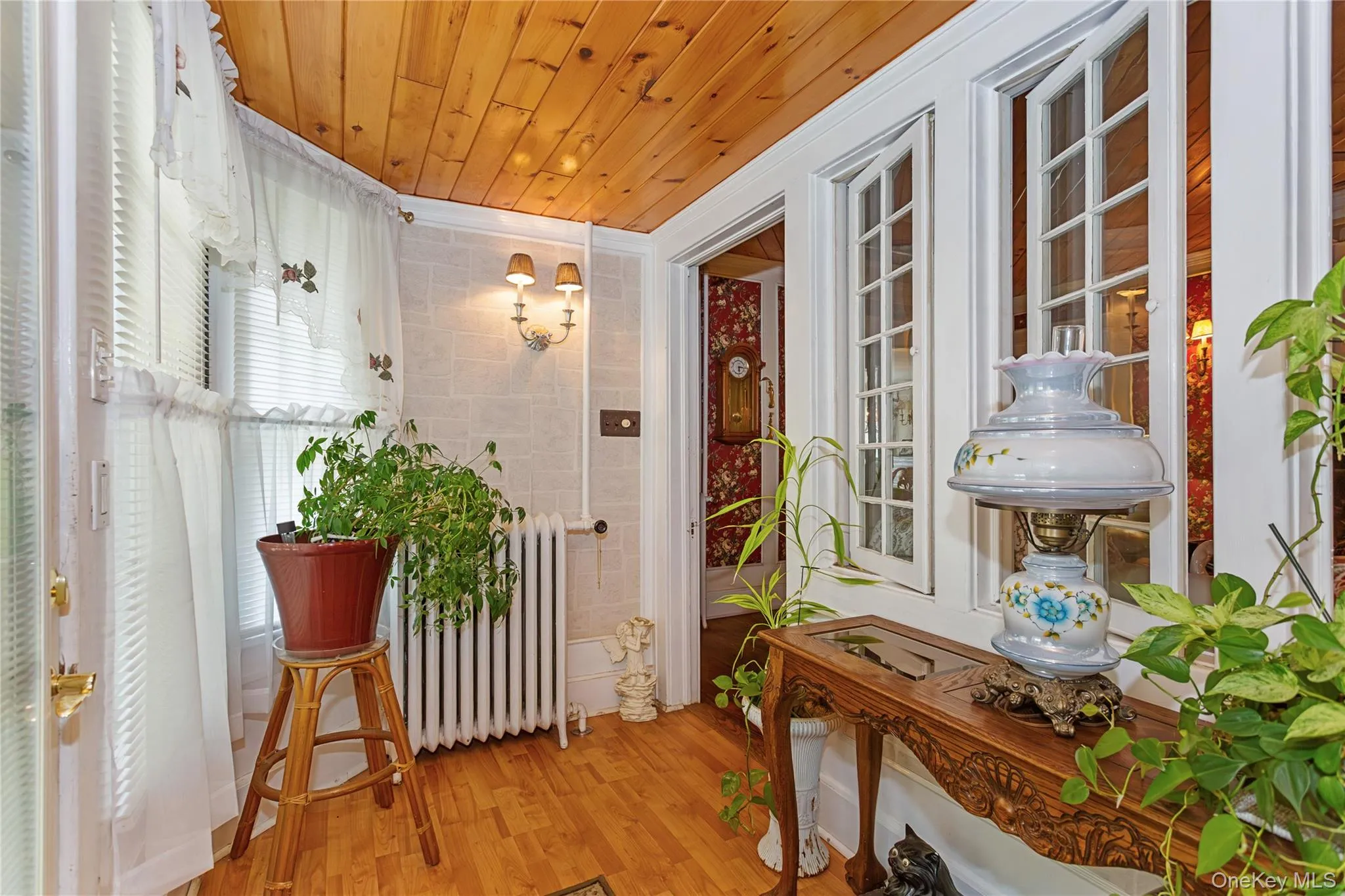 Sunroom / solarium featuring radiator heating unit Sunroom / solarium featuring radiator heating unit